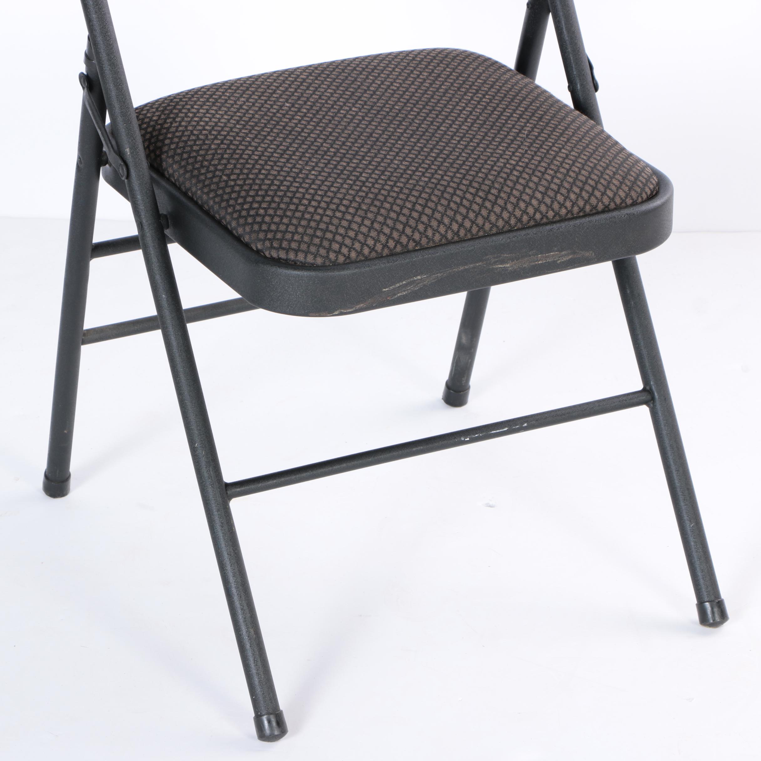 Four Padded Folding Chairs by Cosco