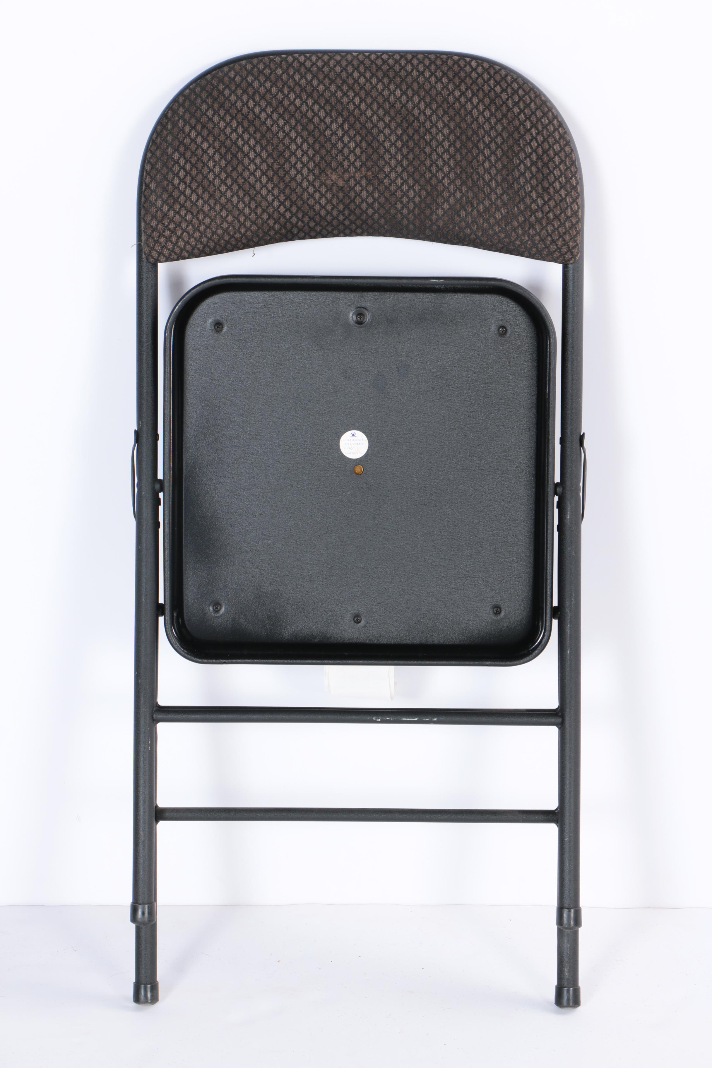 Four Padded Folding Chairs by Cosco