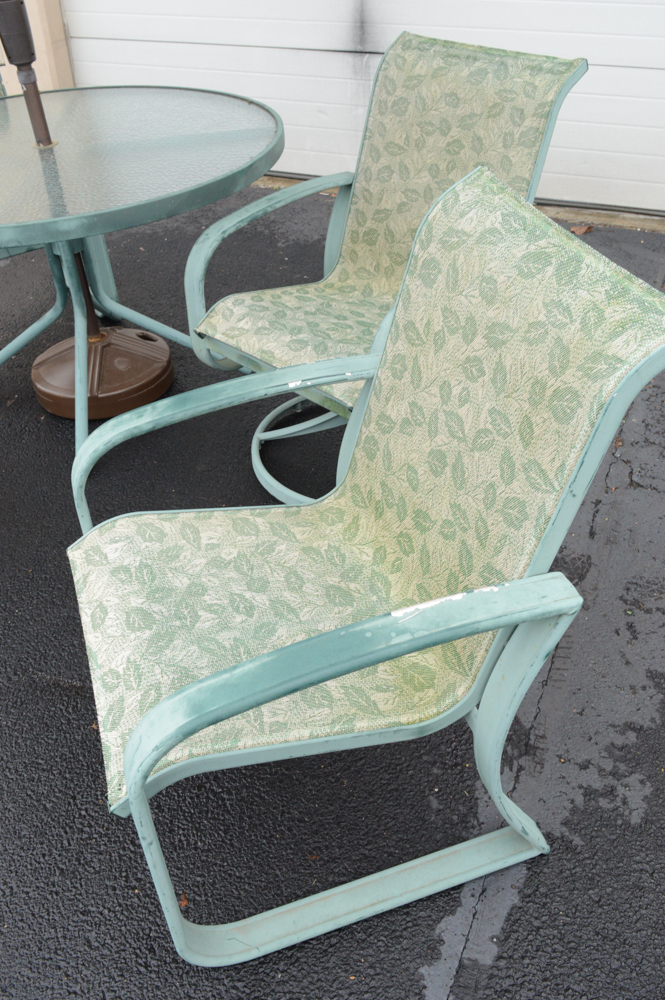 Metal Patio Table With Umbrella and Chairs