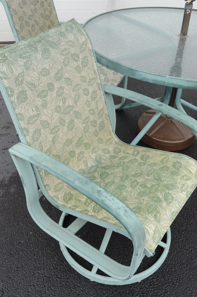 Metal Patio Table With Umbrella and Chairs