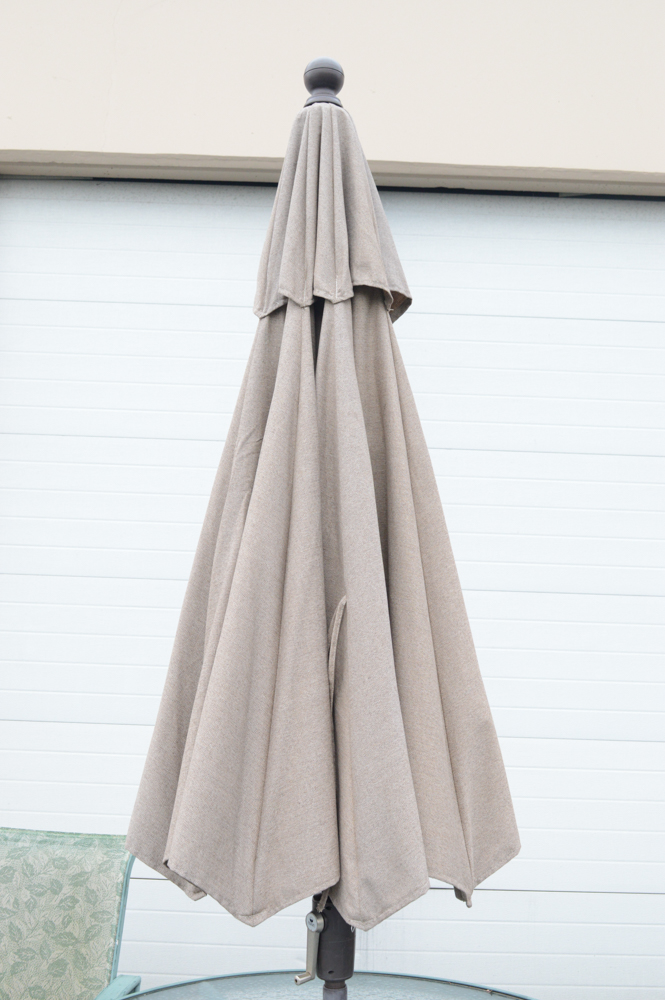 Metal Patio Table With Umbrella and Chairs