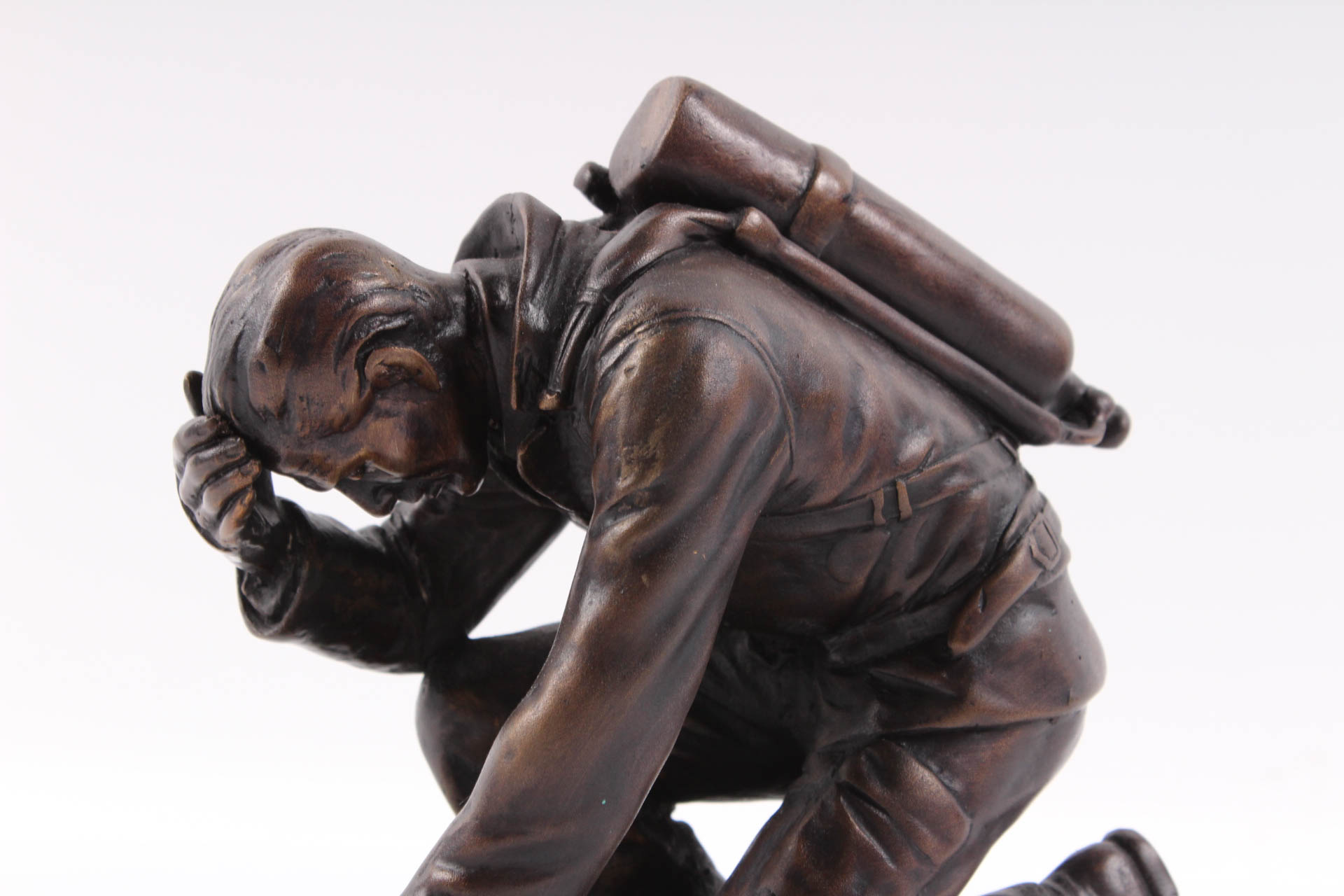 Kneeling Firefighter Bronze Sculpture