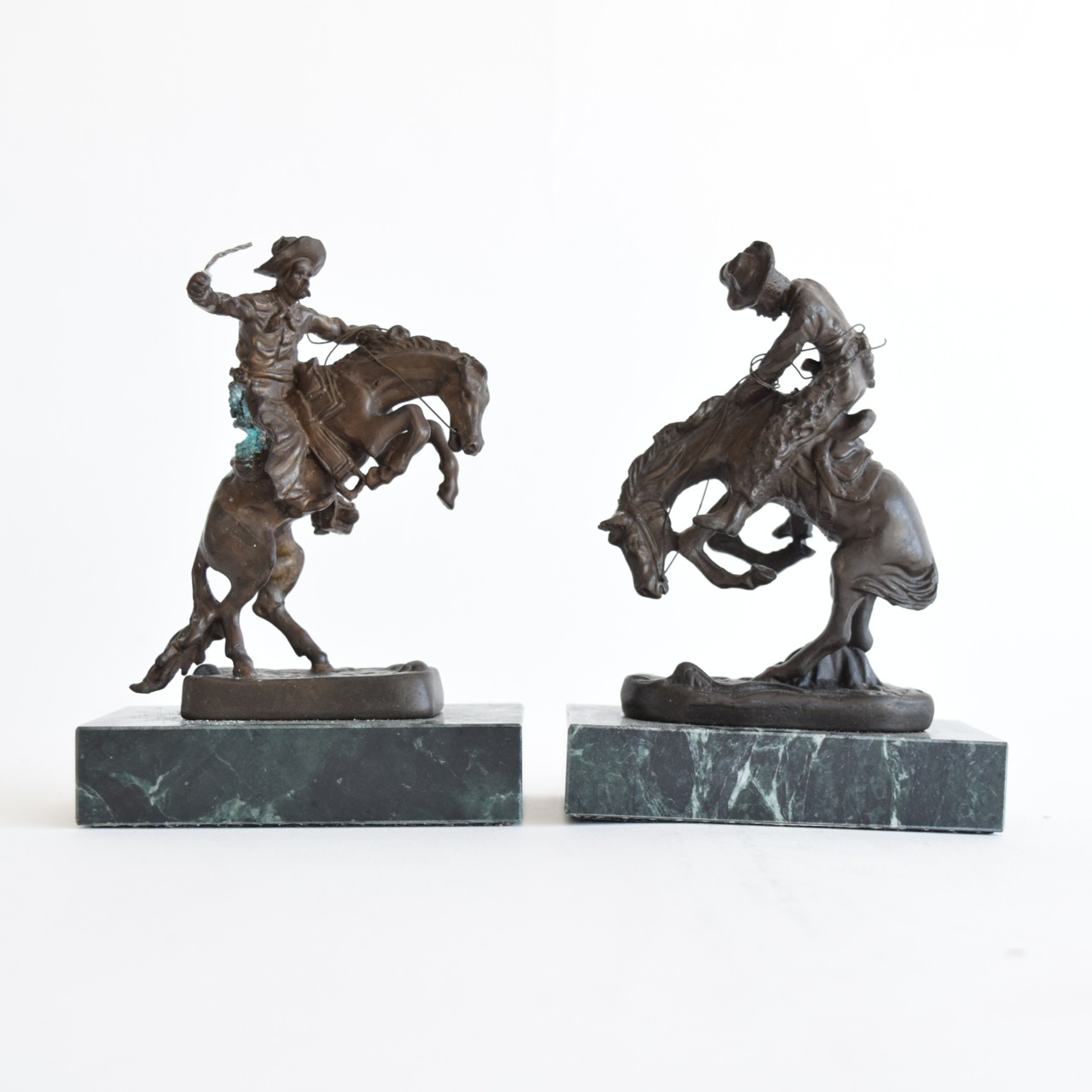 "The Rattlesnake" and "Bronco Buster" Reproduction Sculptures After Frederic Remington
