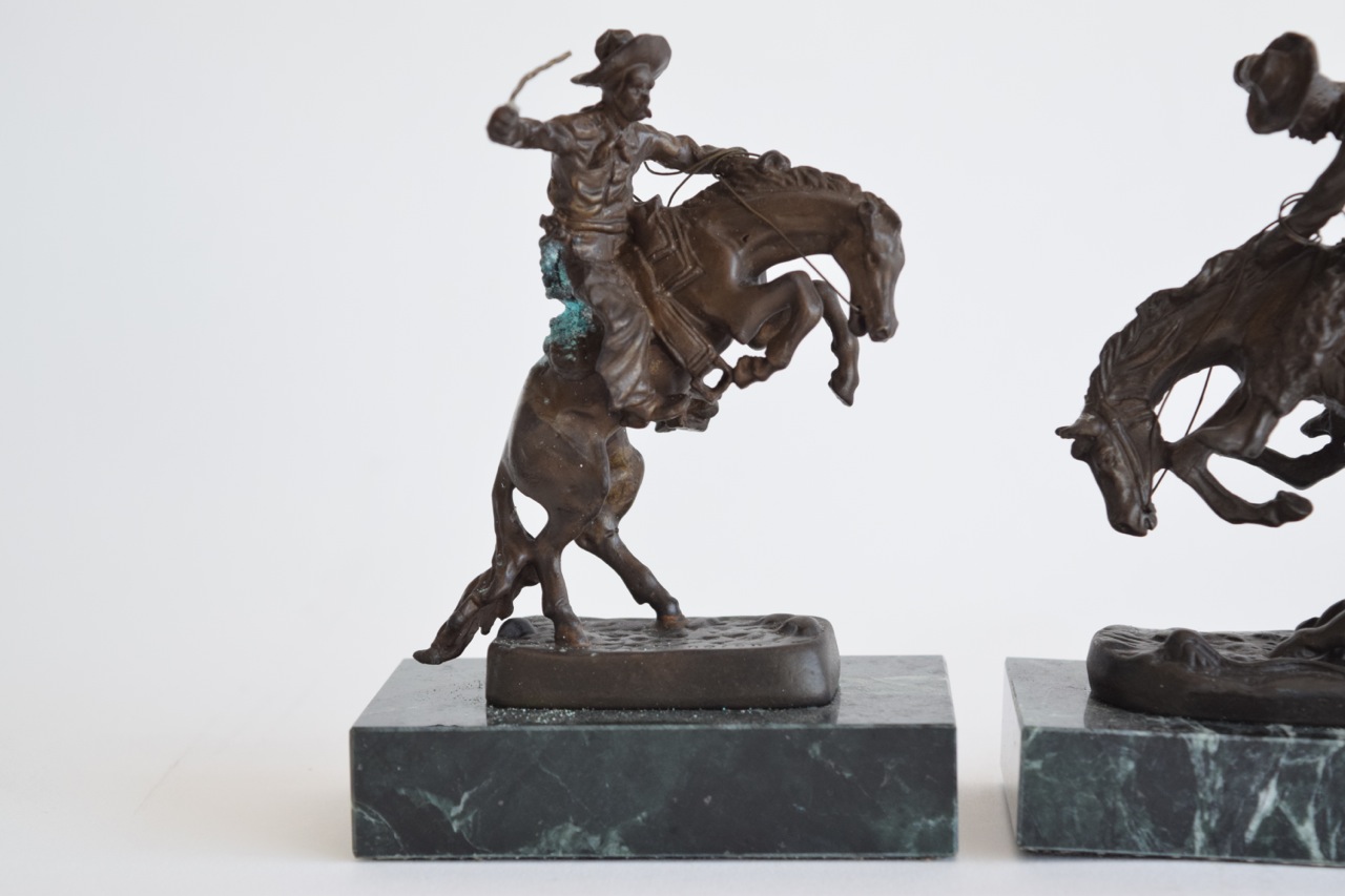 "The Rattlesnake" and "Bronco Buster" Reproduction Sculptures After Frederic Remington