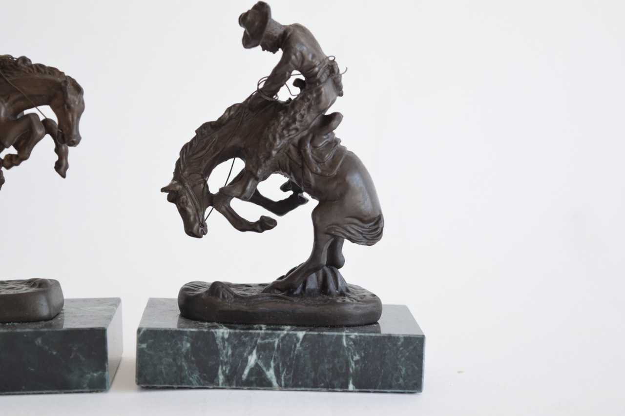 "The Rattlesnake" and "Bronco Buster" Reproduction Sculptures After Frederic Remington
