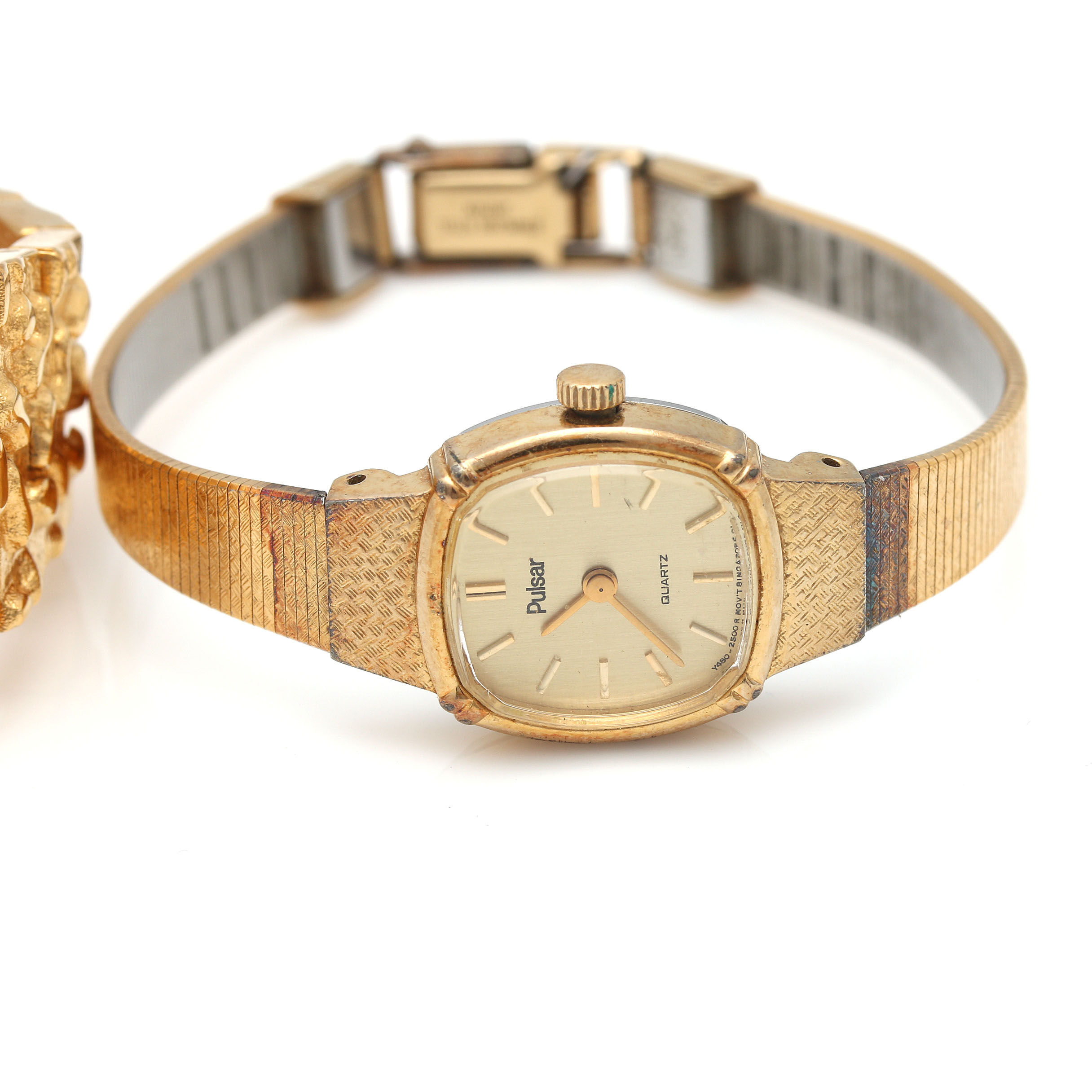 An Assortment of Gold Tone Watches Including Genevex and Pulsar
