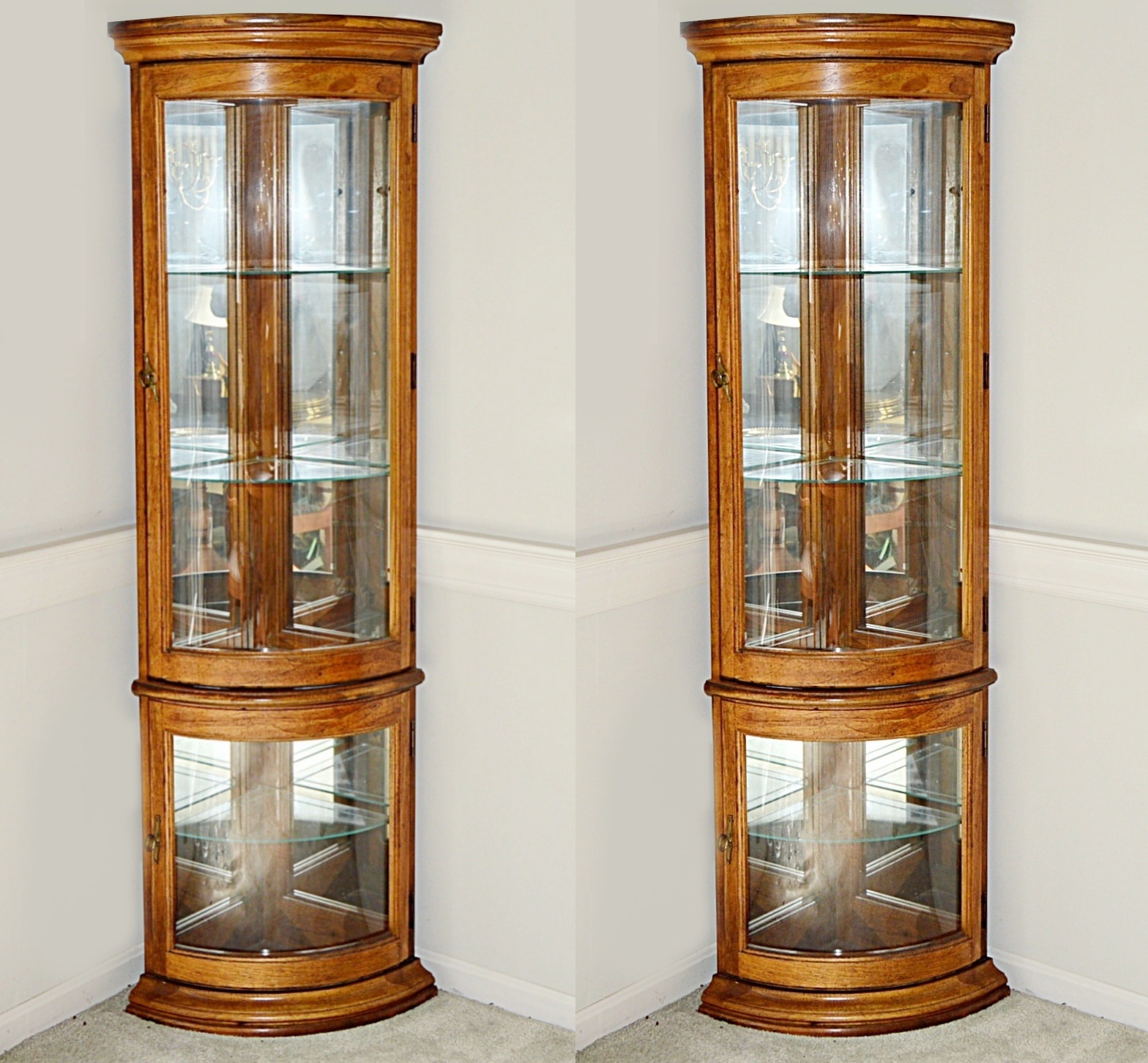 Pair of Lighted Curved Glass Corner Display Cabinets