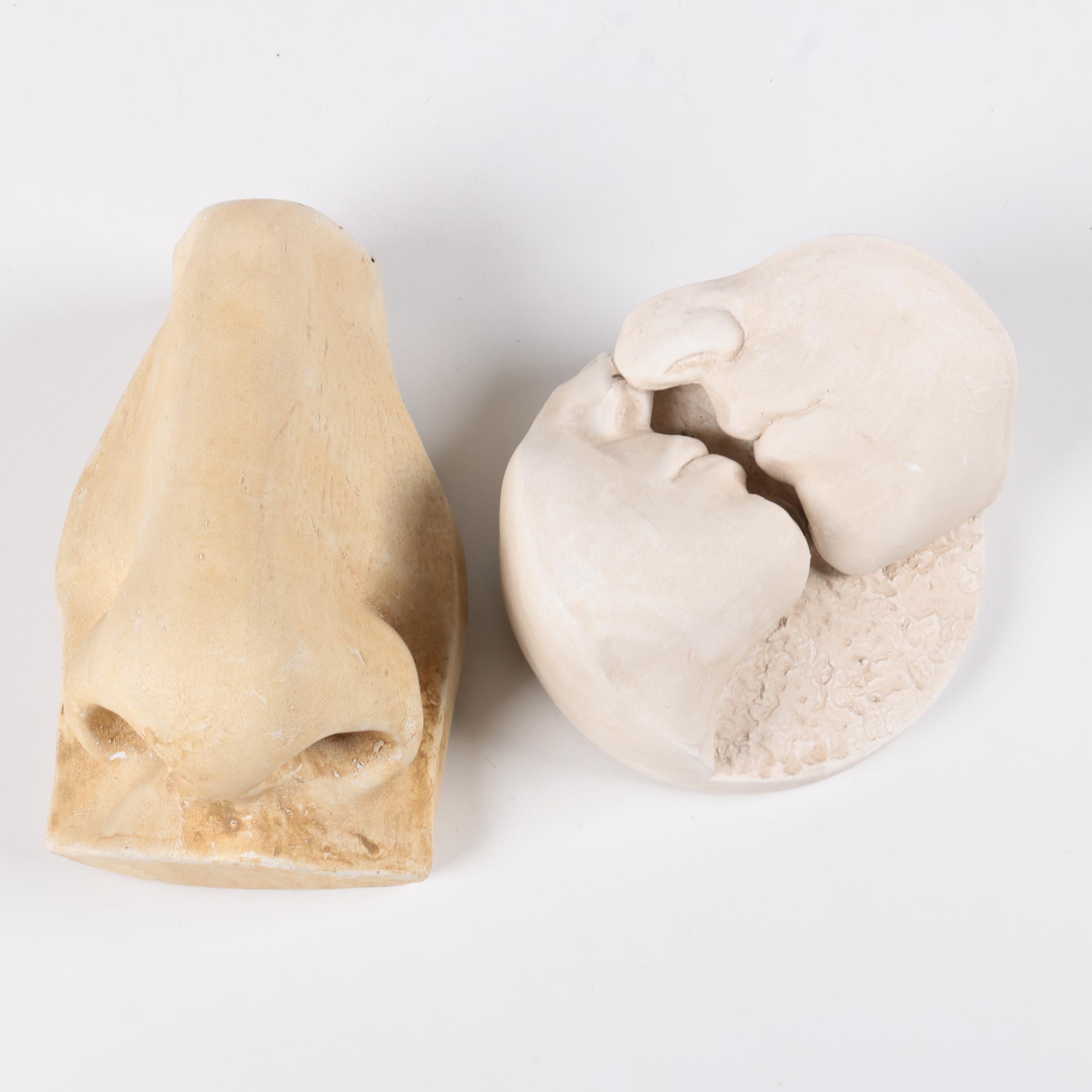 Decorative Plaster Wall Hangings Featuring Kissing Faces