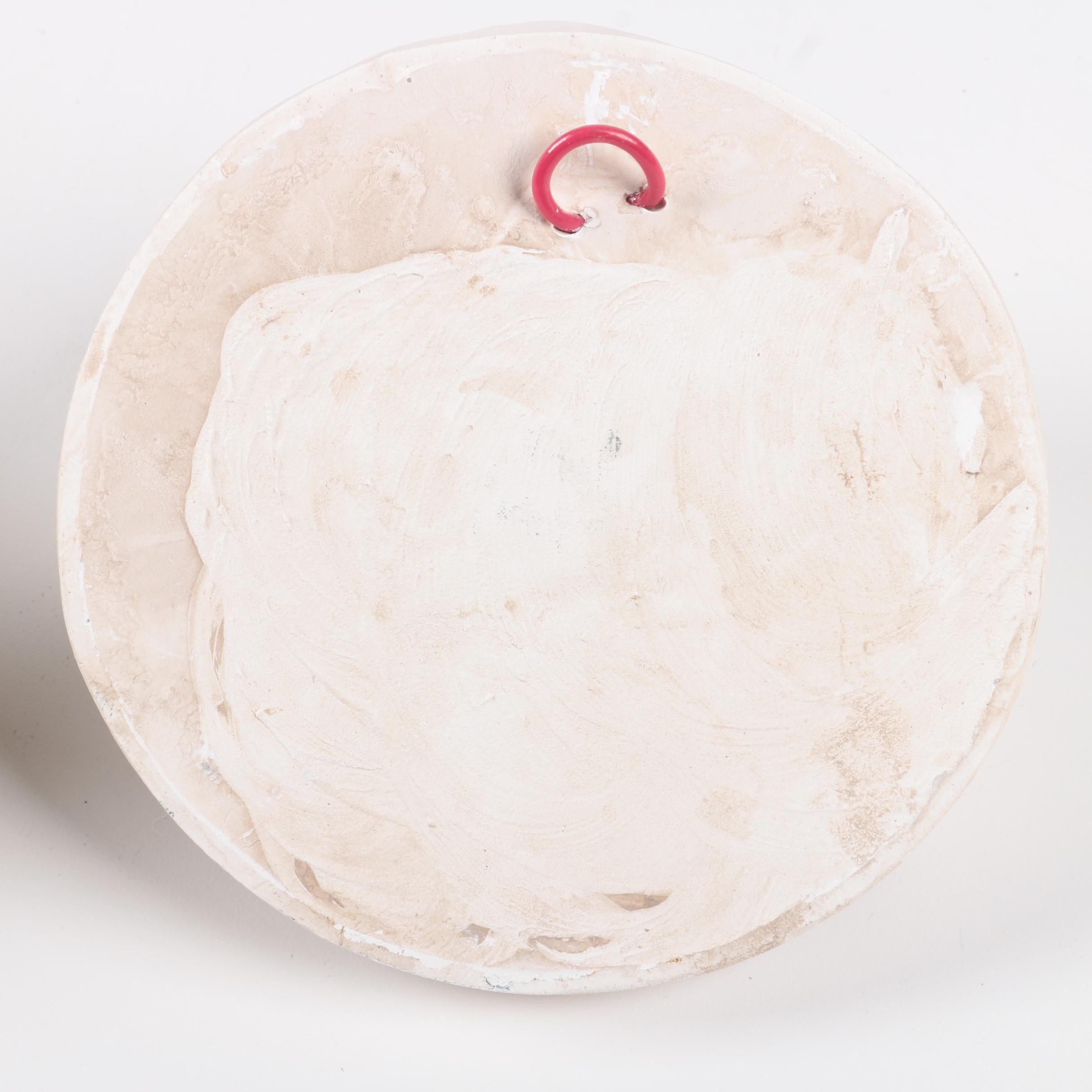 Decorative Plaster Wall Hangings Featuring Kissing Faces