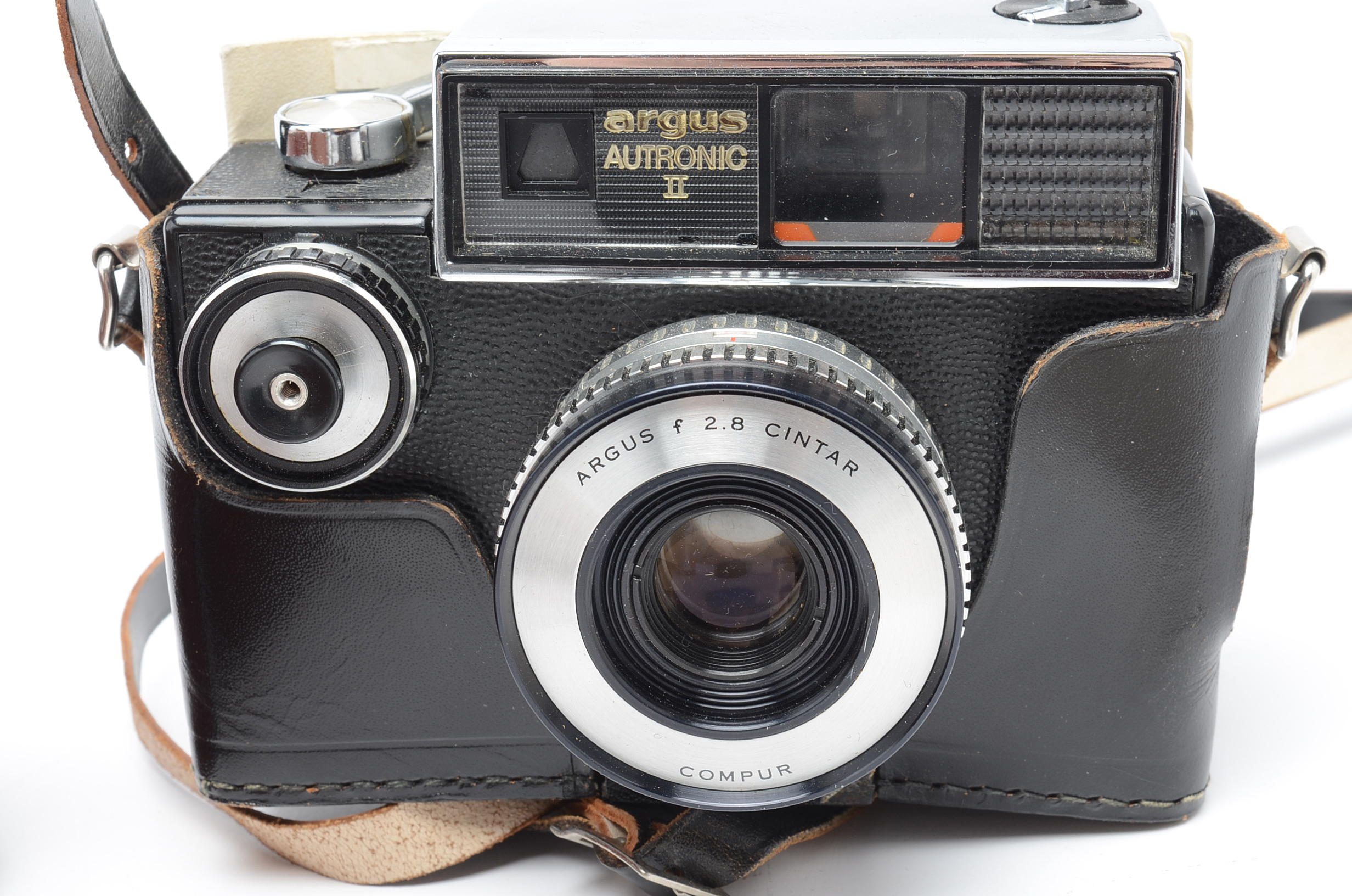 Assortment of Vintage Camera Lenses and Argus Autronic II Camera