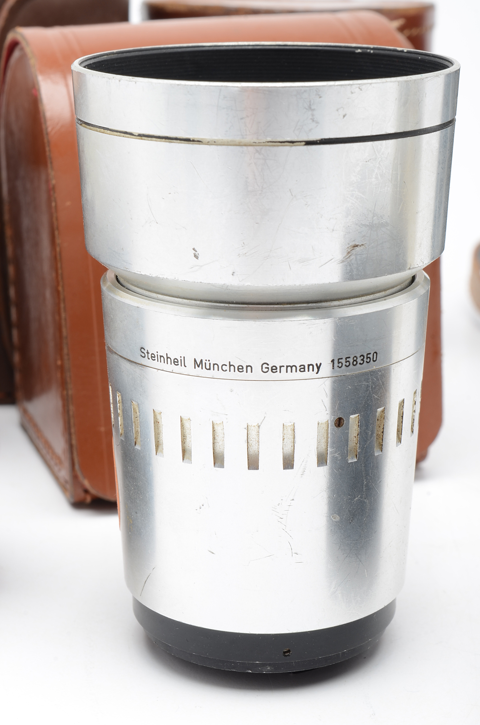 Assortment of Vintage Camera Lenses and Argus Autronic II Camera