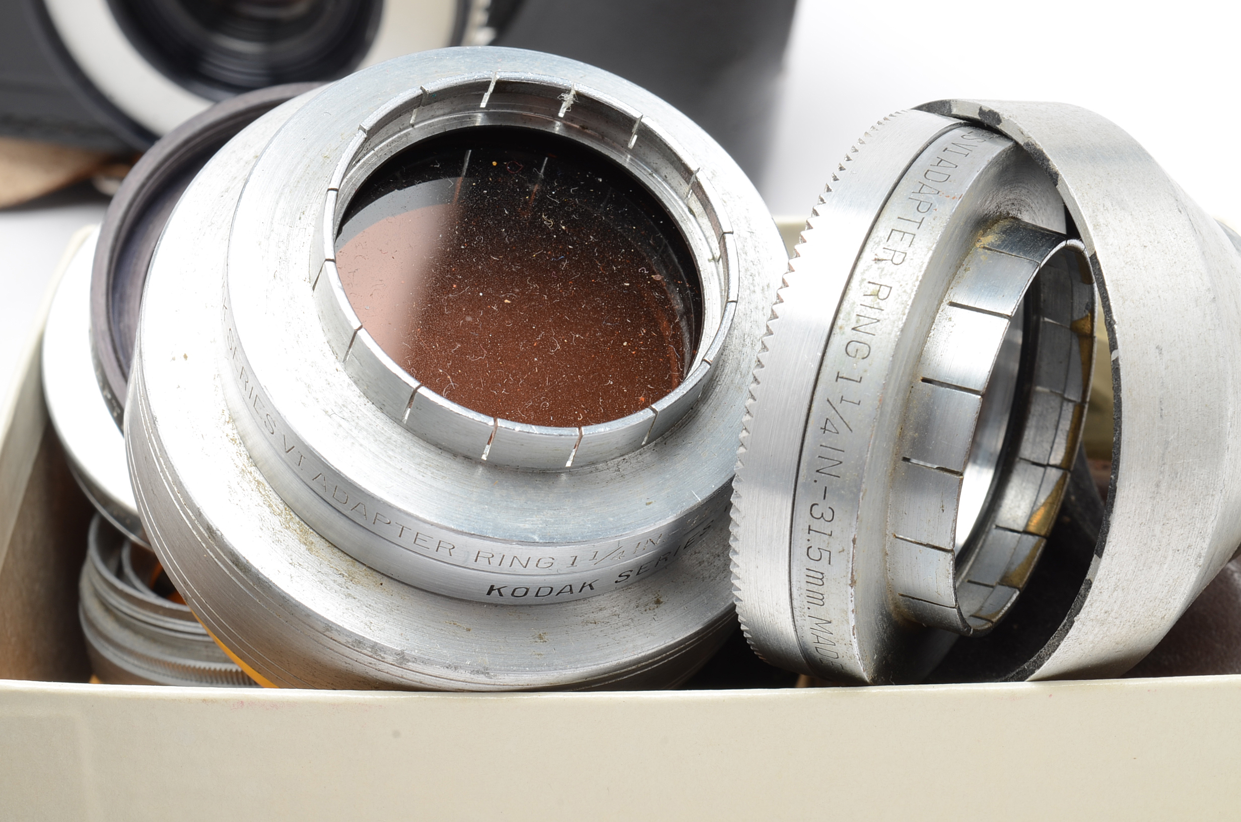 Assortment of Vintage Camera Lenses and Argus Autronic II Camera