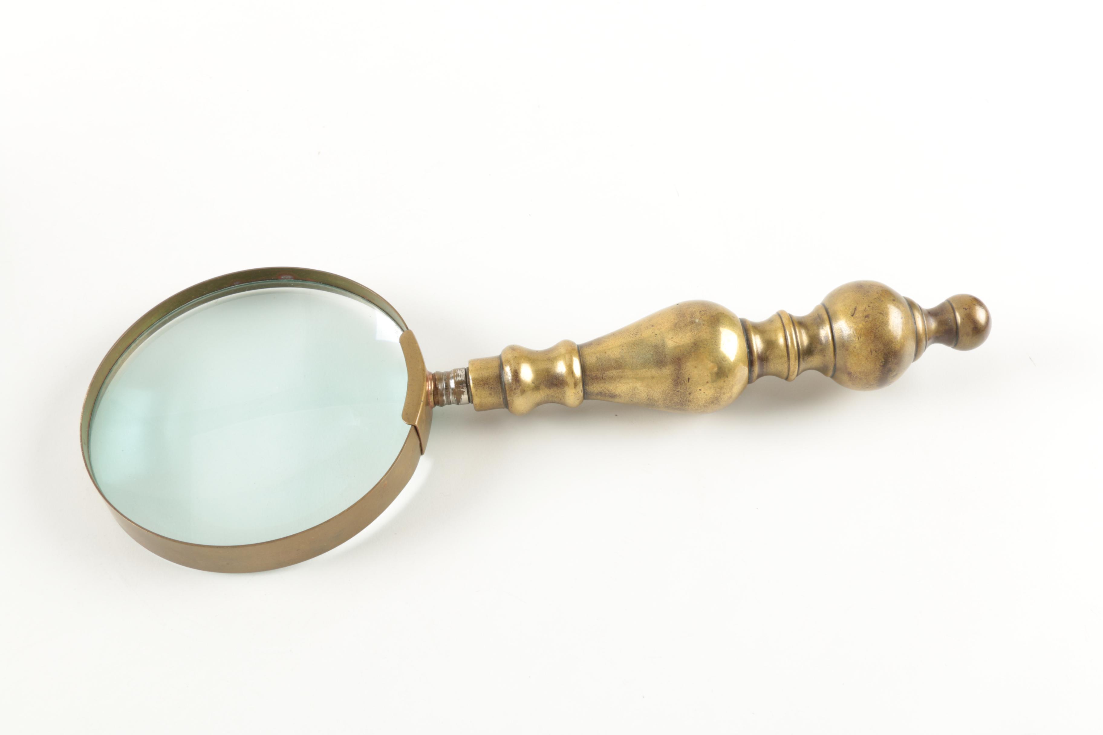 Six Antique Books and Magnifying Glass