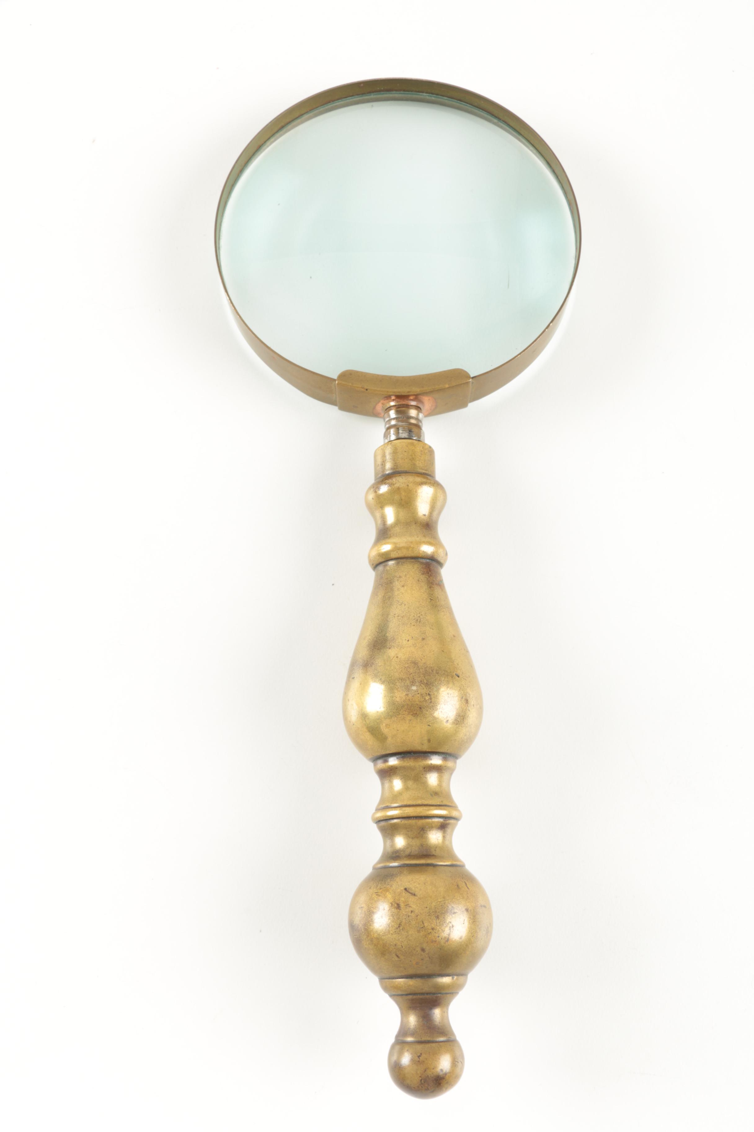 Six Antique Books and Magnifying Glass