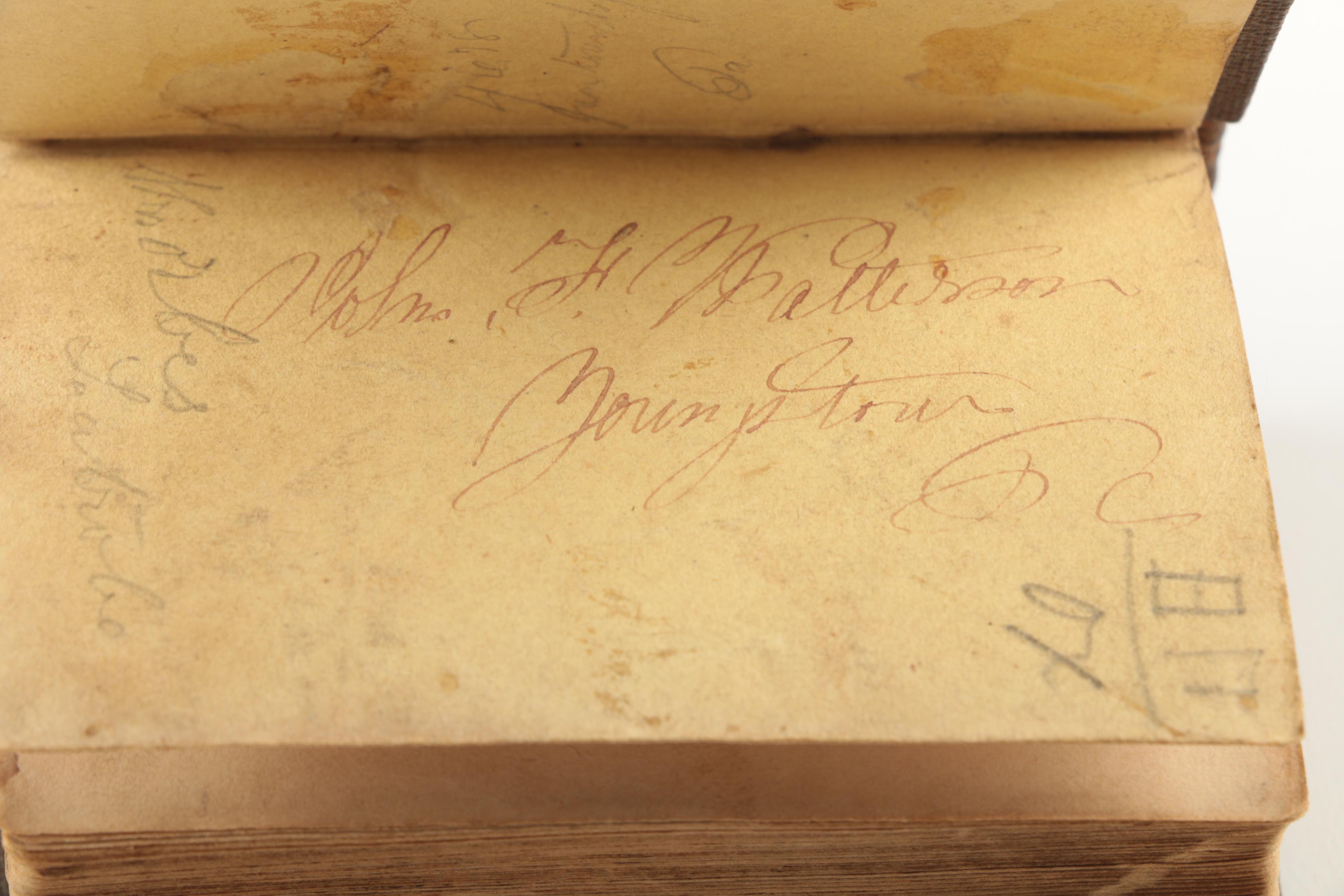 Six Antique Books and Magnifying Glass
