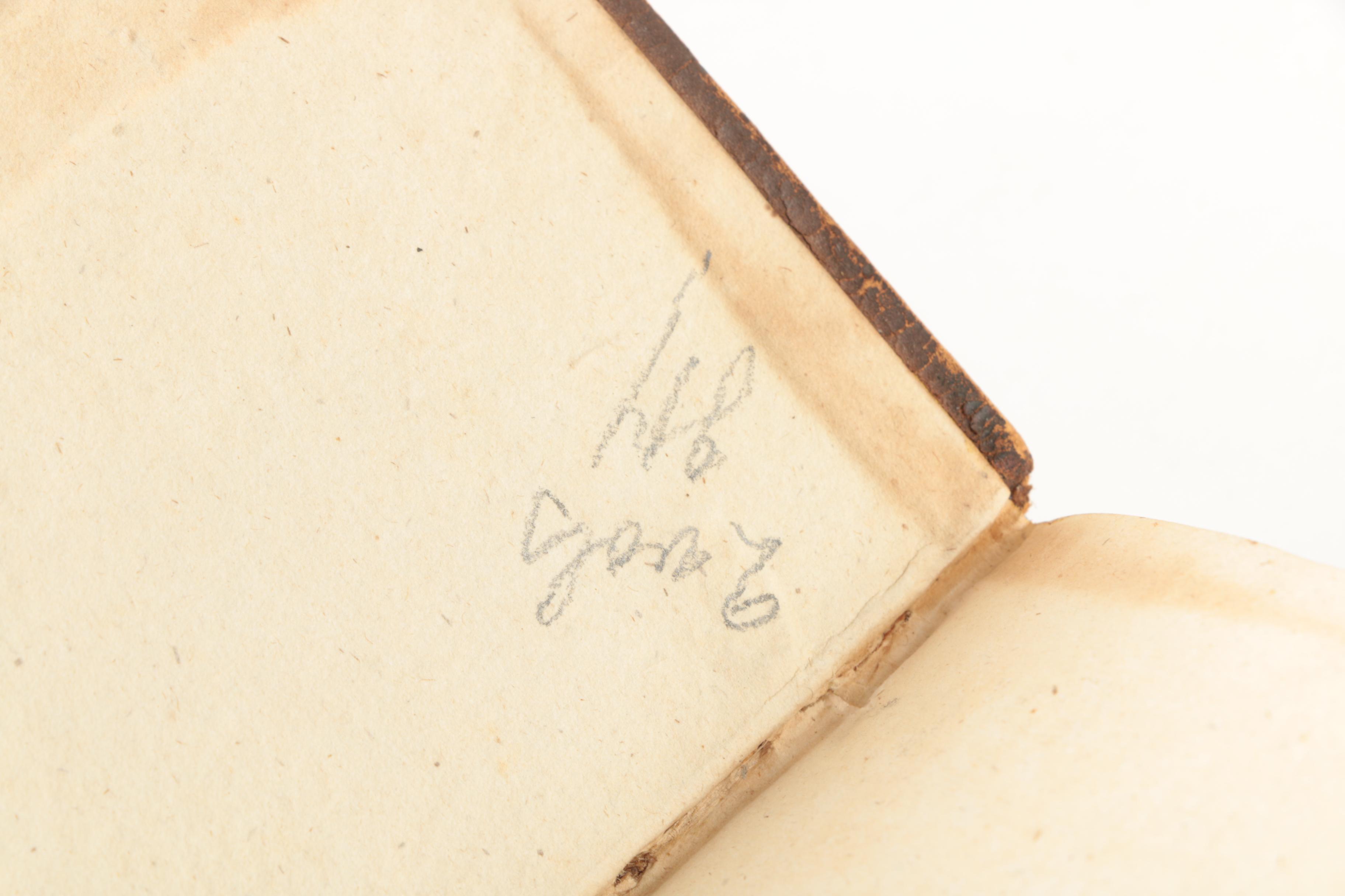 Six Antique Books and Magnifying Glass