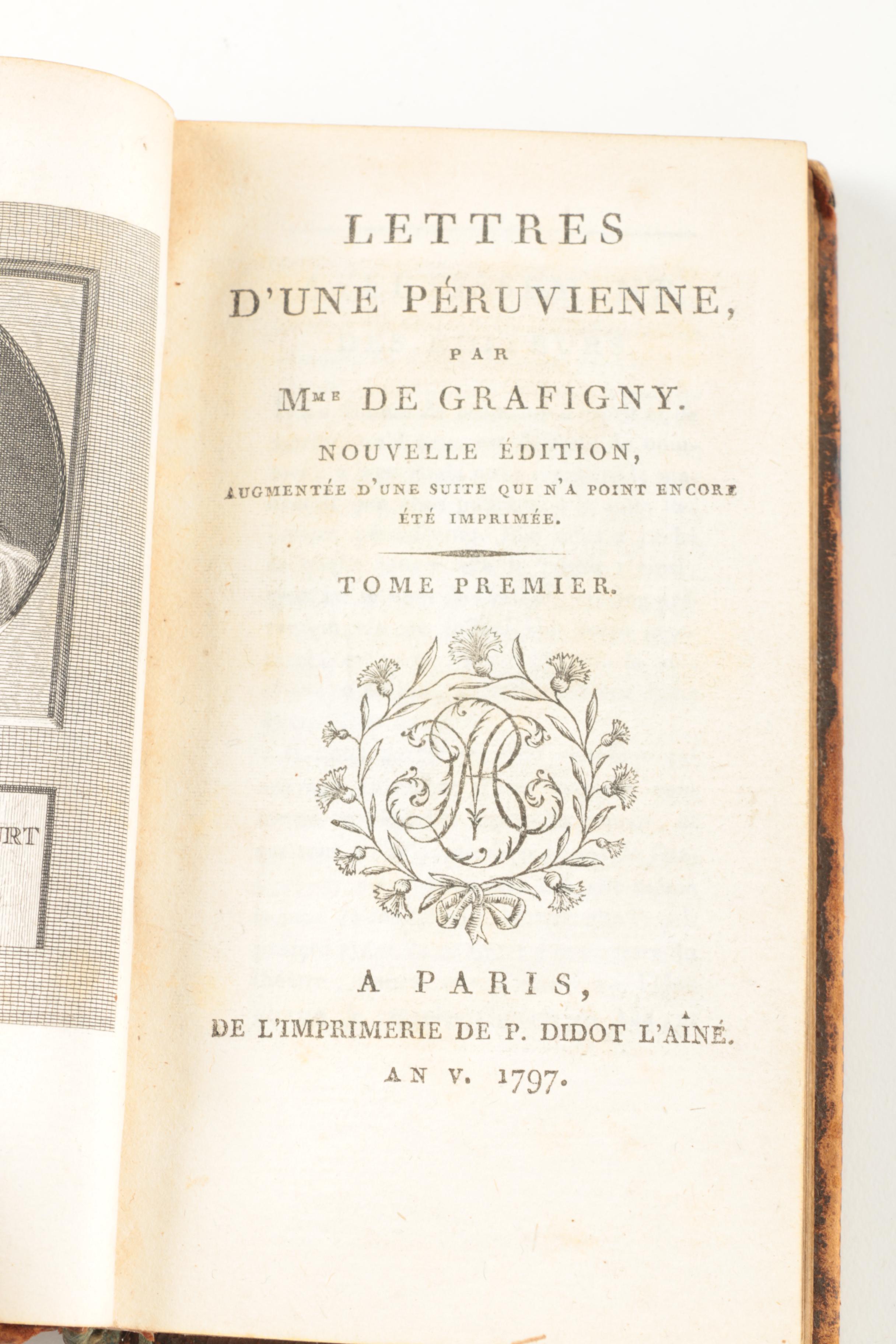 Six Antique Books and Magnifying Glass