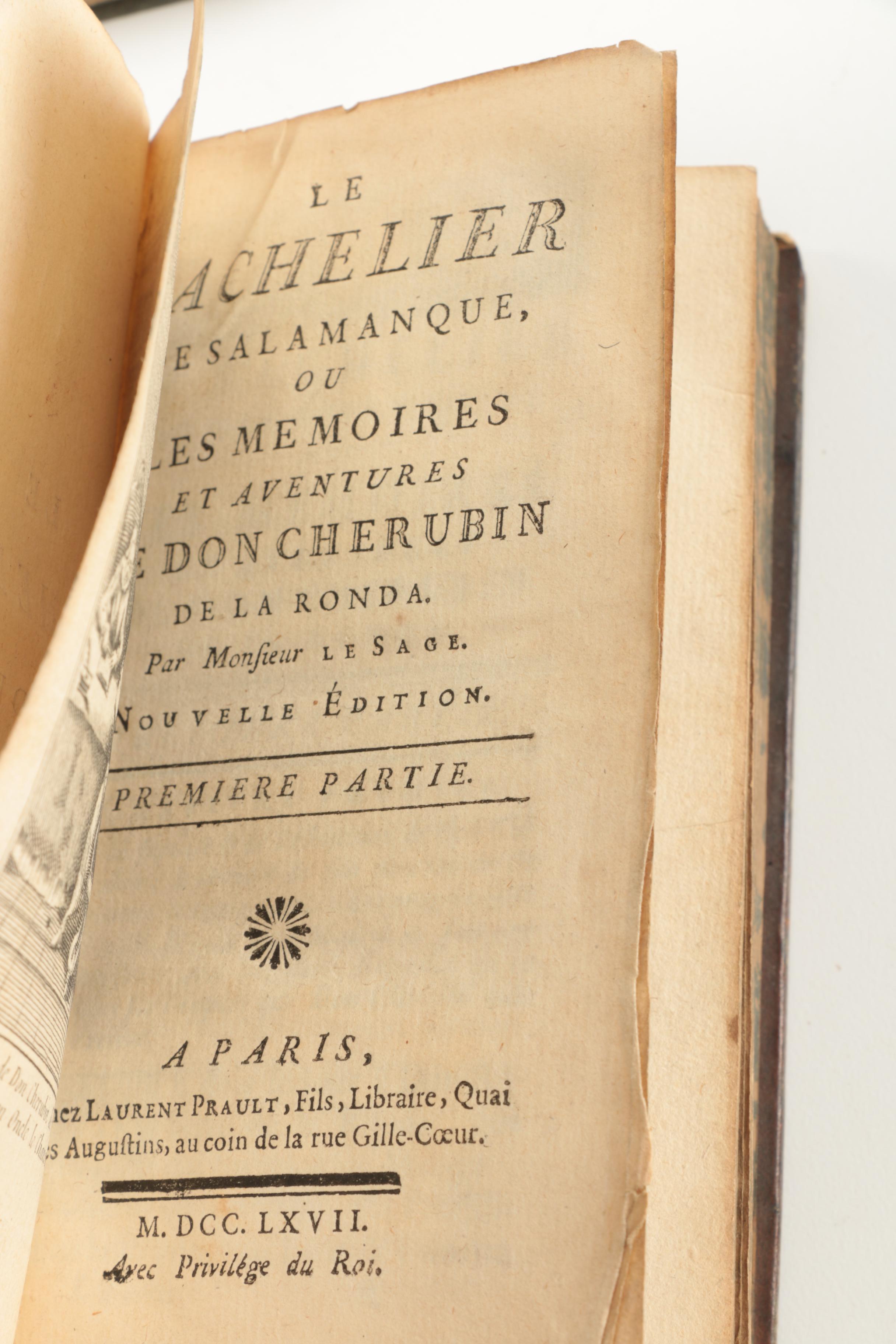 Six Antique Books and Magnifying Glass