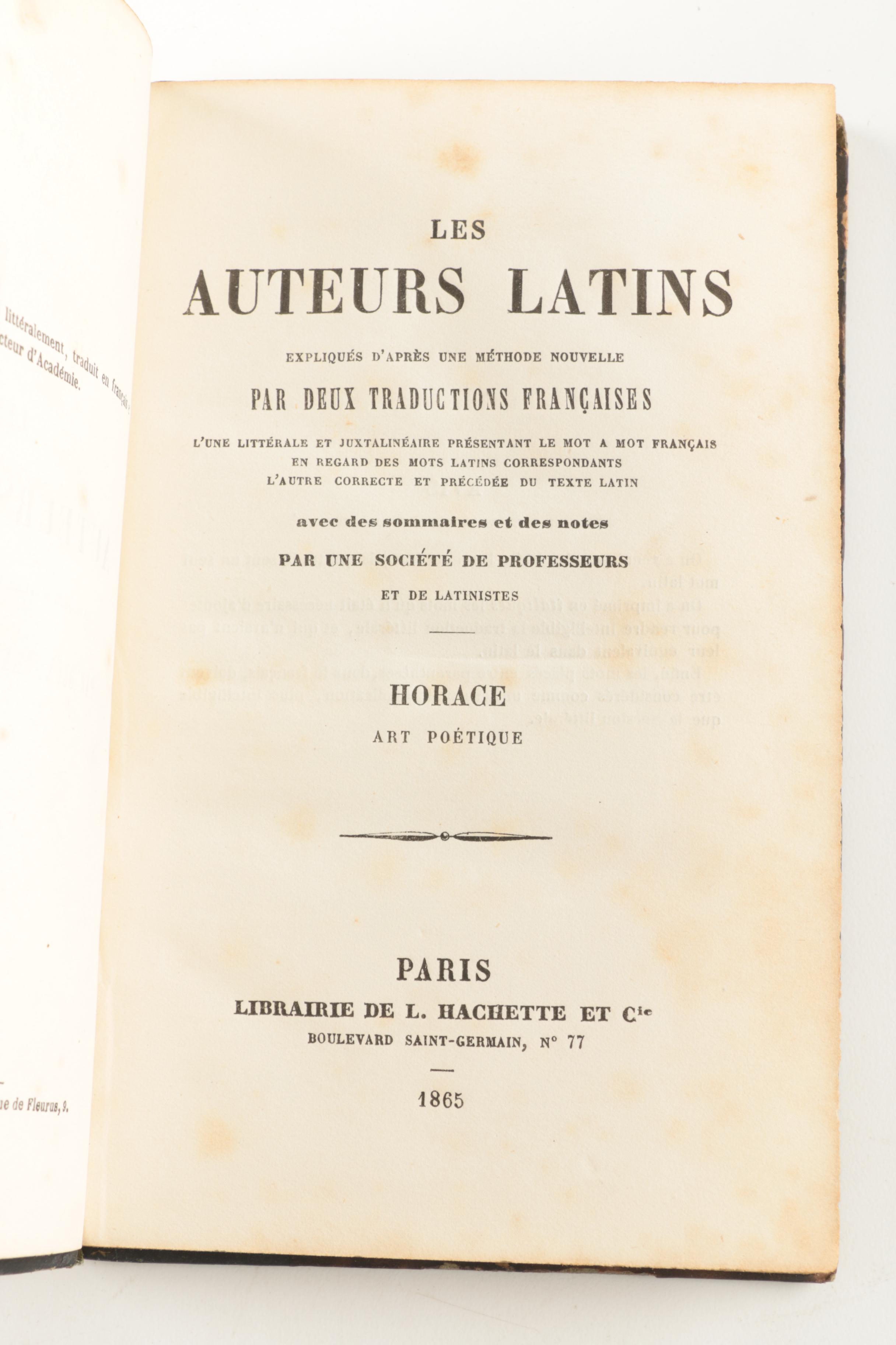 Six Antique Books and Magnifying Glass