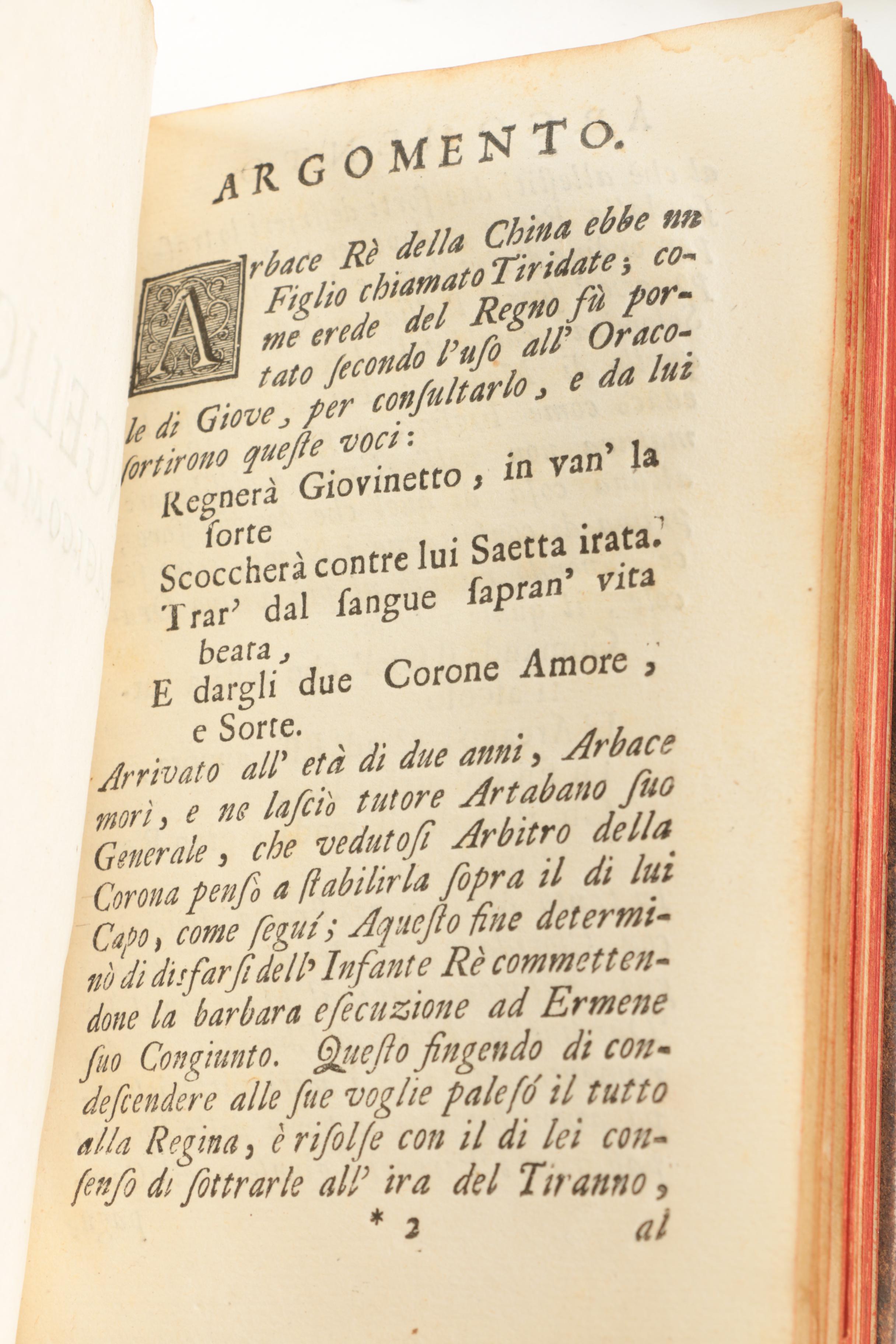 Six Antique Books and Magnifying Glass