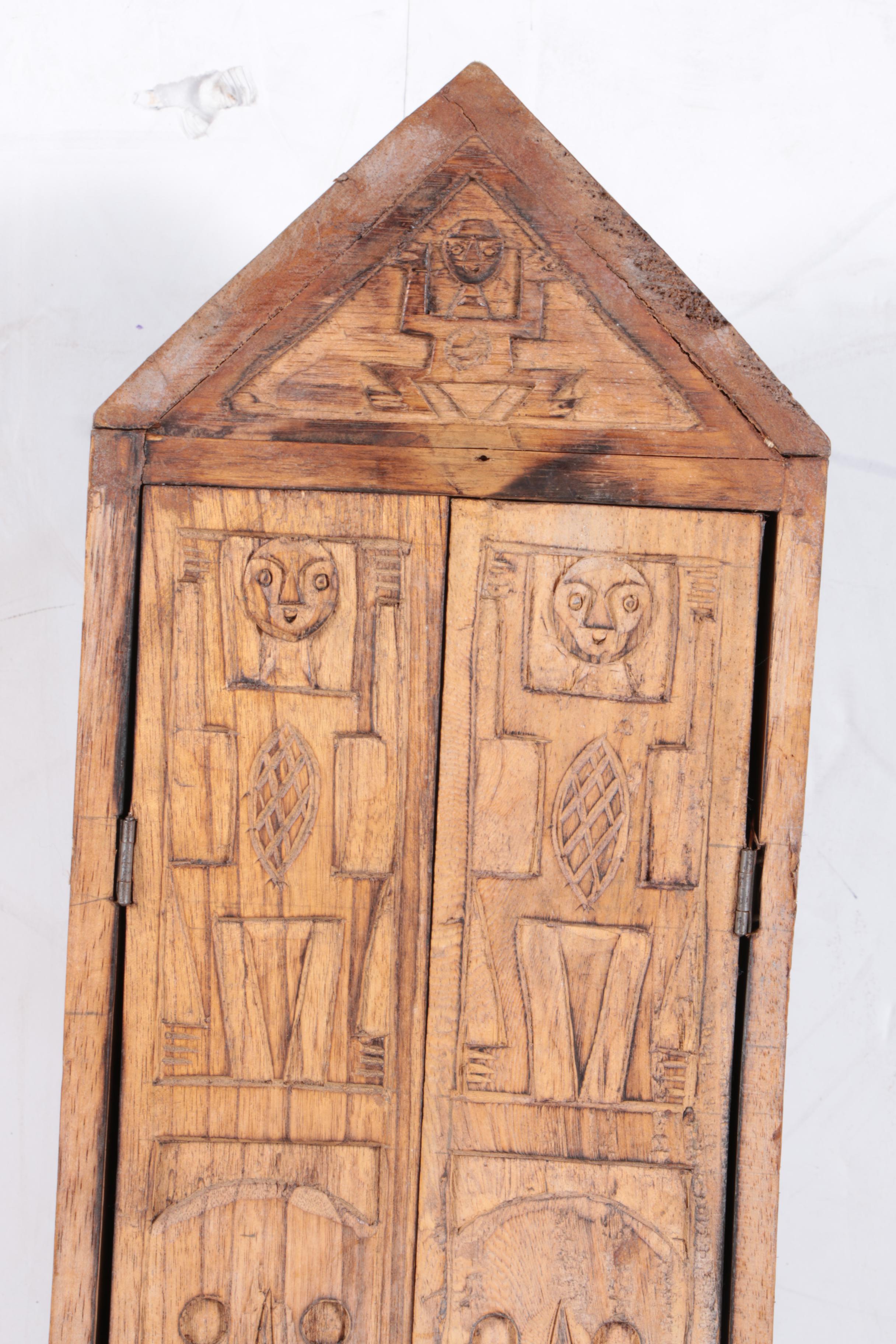 Carved Walnut Cabinet and Two Arrows