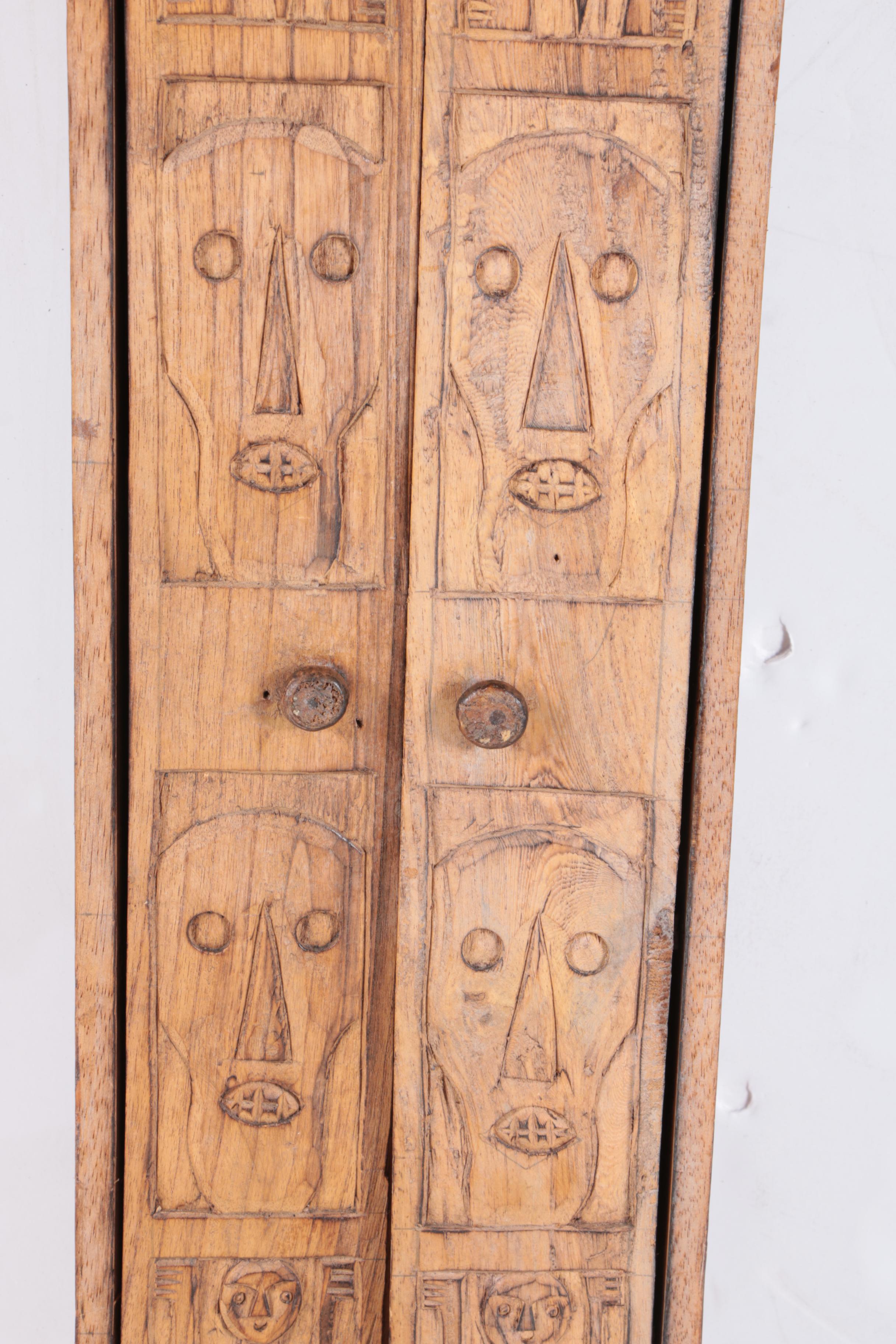 Carved Walnut Cabinet and Two Arrows