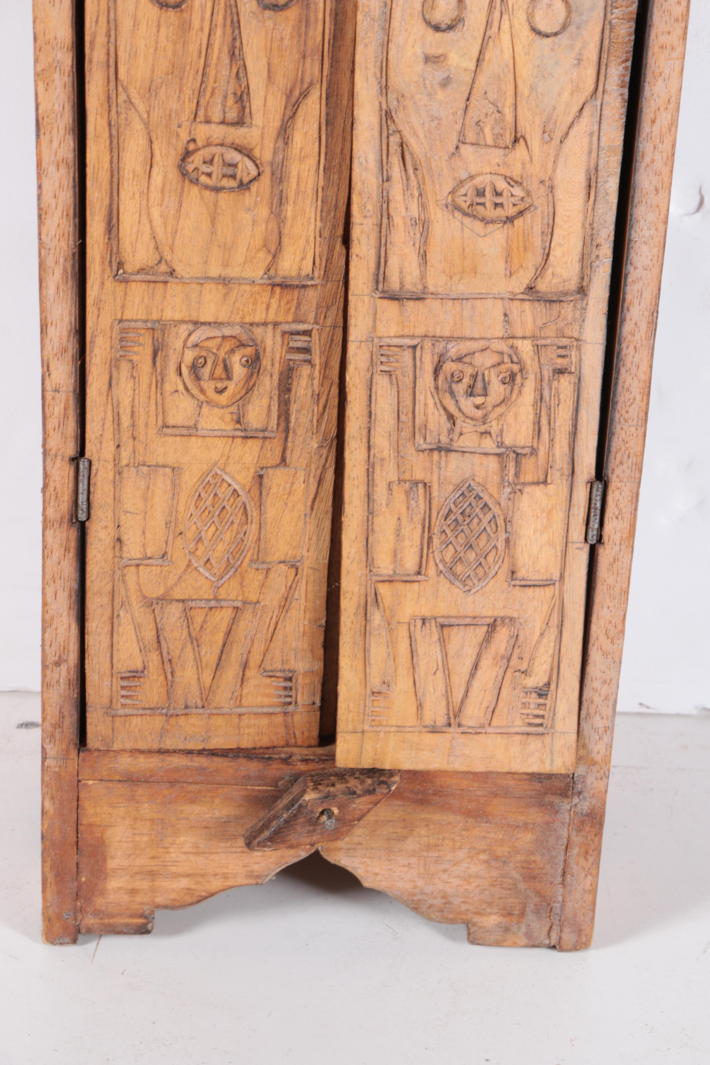 Carved Walnut Cabinet and Two Arrows