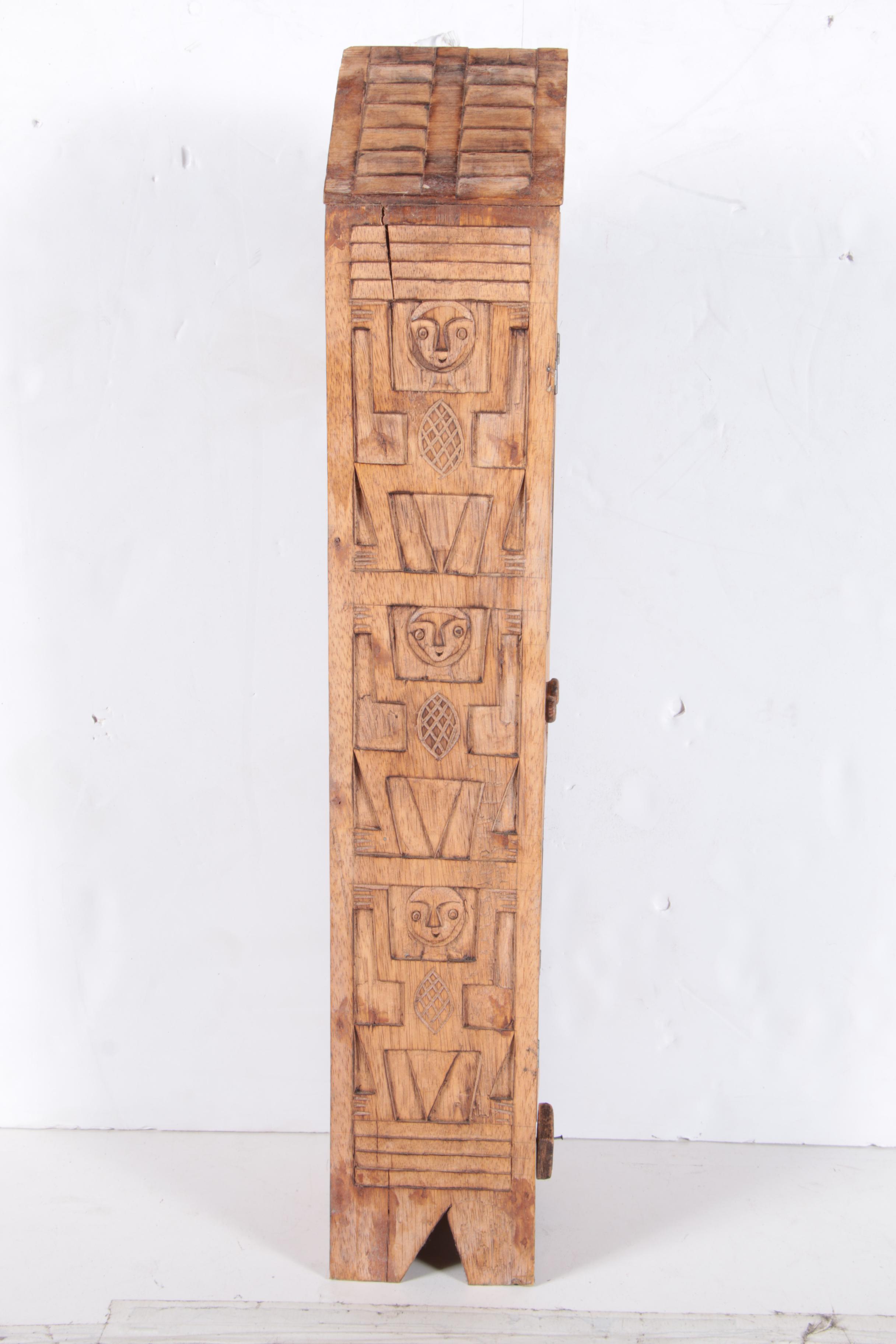 Carved Walnut Cabinet and Two Arrows