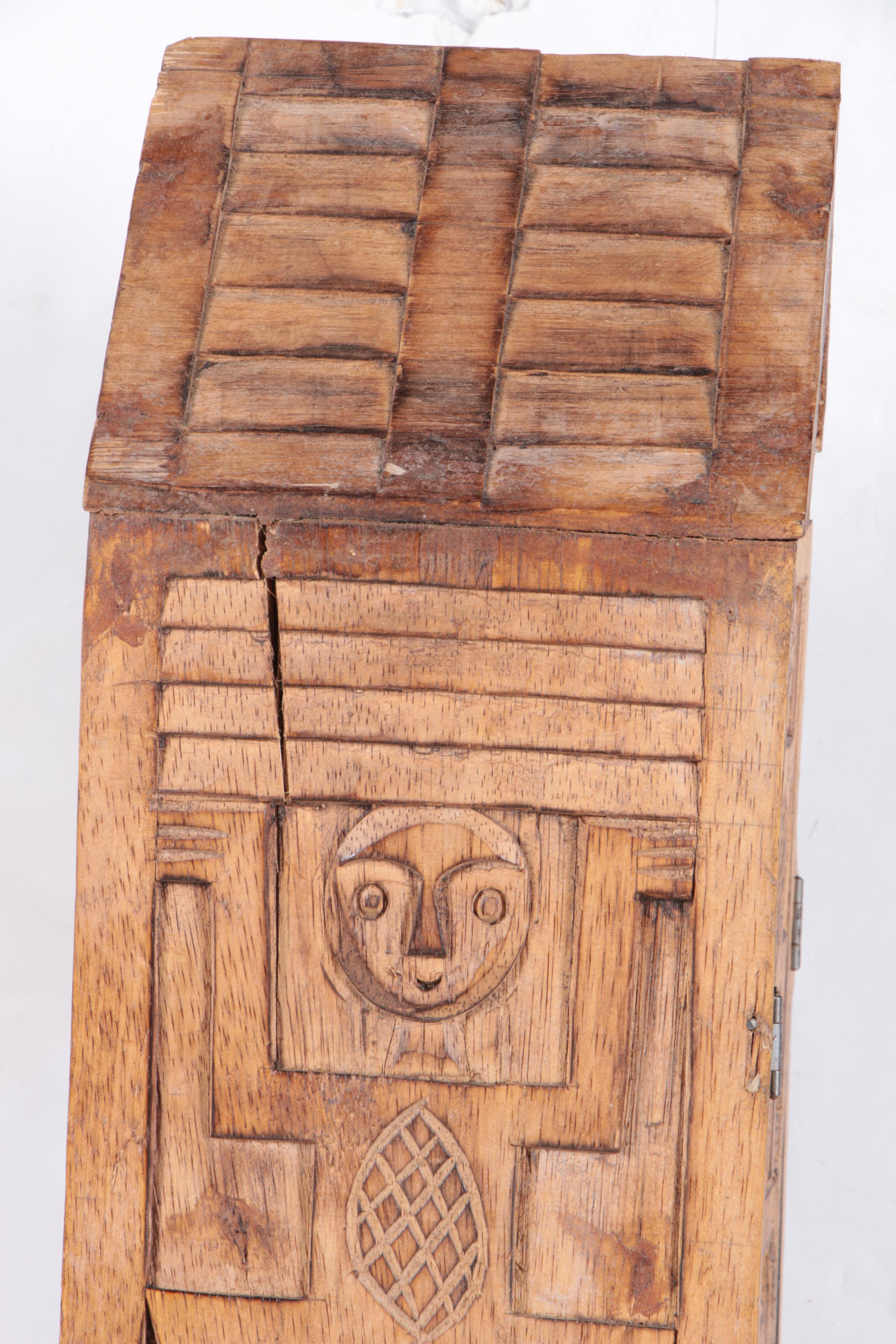 Carved Walnut Cabinet and Two Arrows