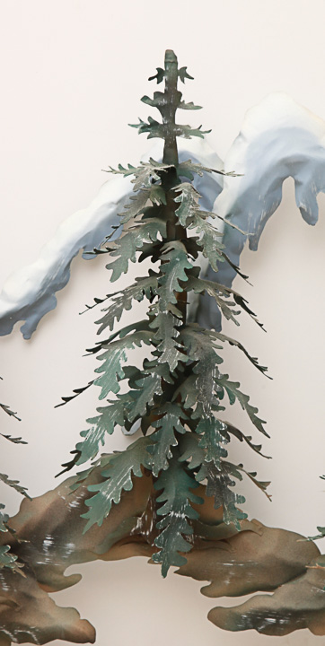 Metal Sculpture of a Woodland Scene with Snowy Mountains