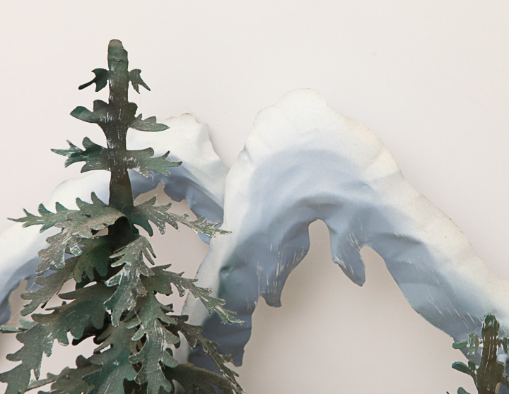 Metal Sculpture of a Woodland Scene with Snowy Mountains