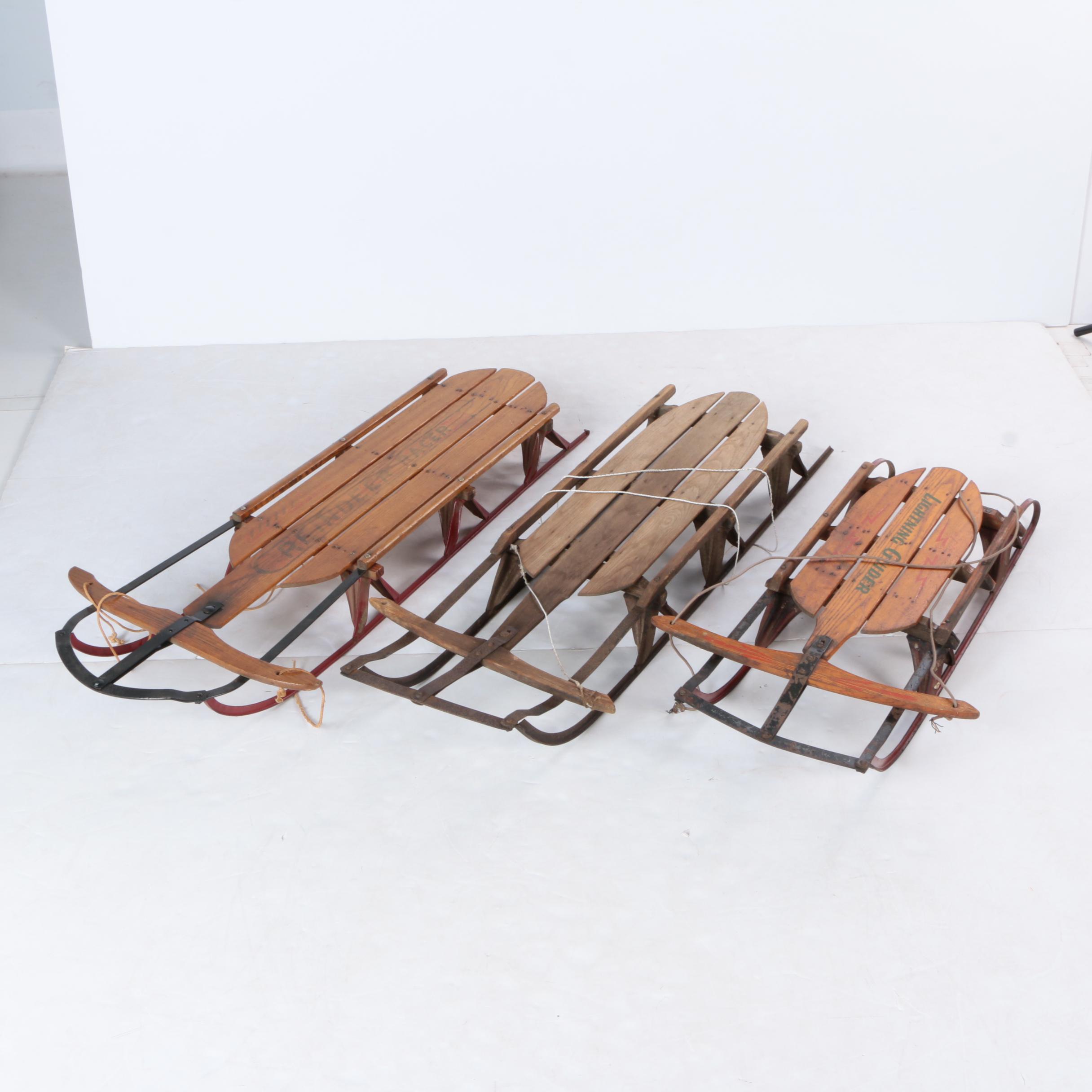 Three Vintage Wood and Metal Sleds