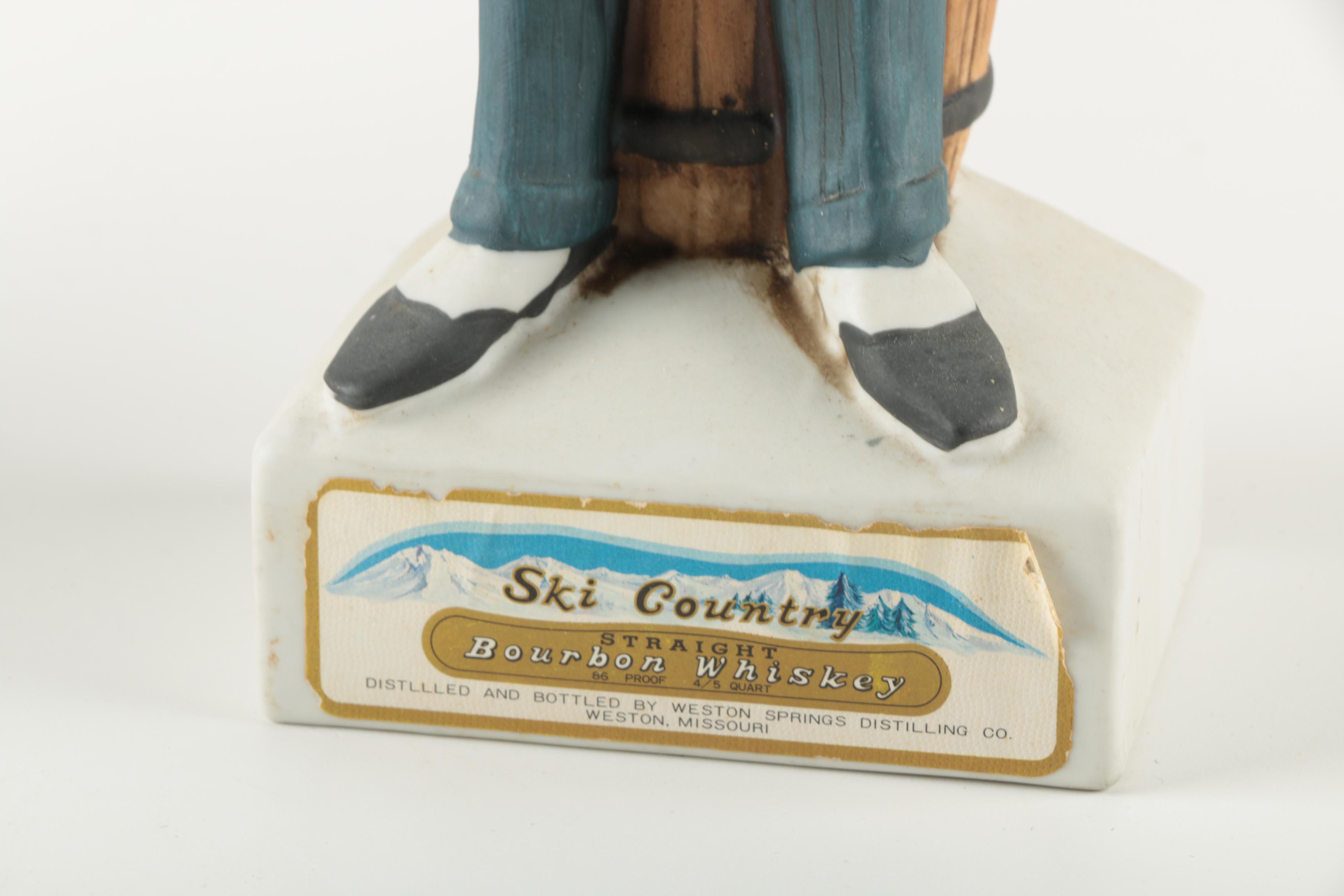 Ski-Country Bonnie and Clyde Series Bourbon Bottles an Figurines