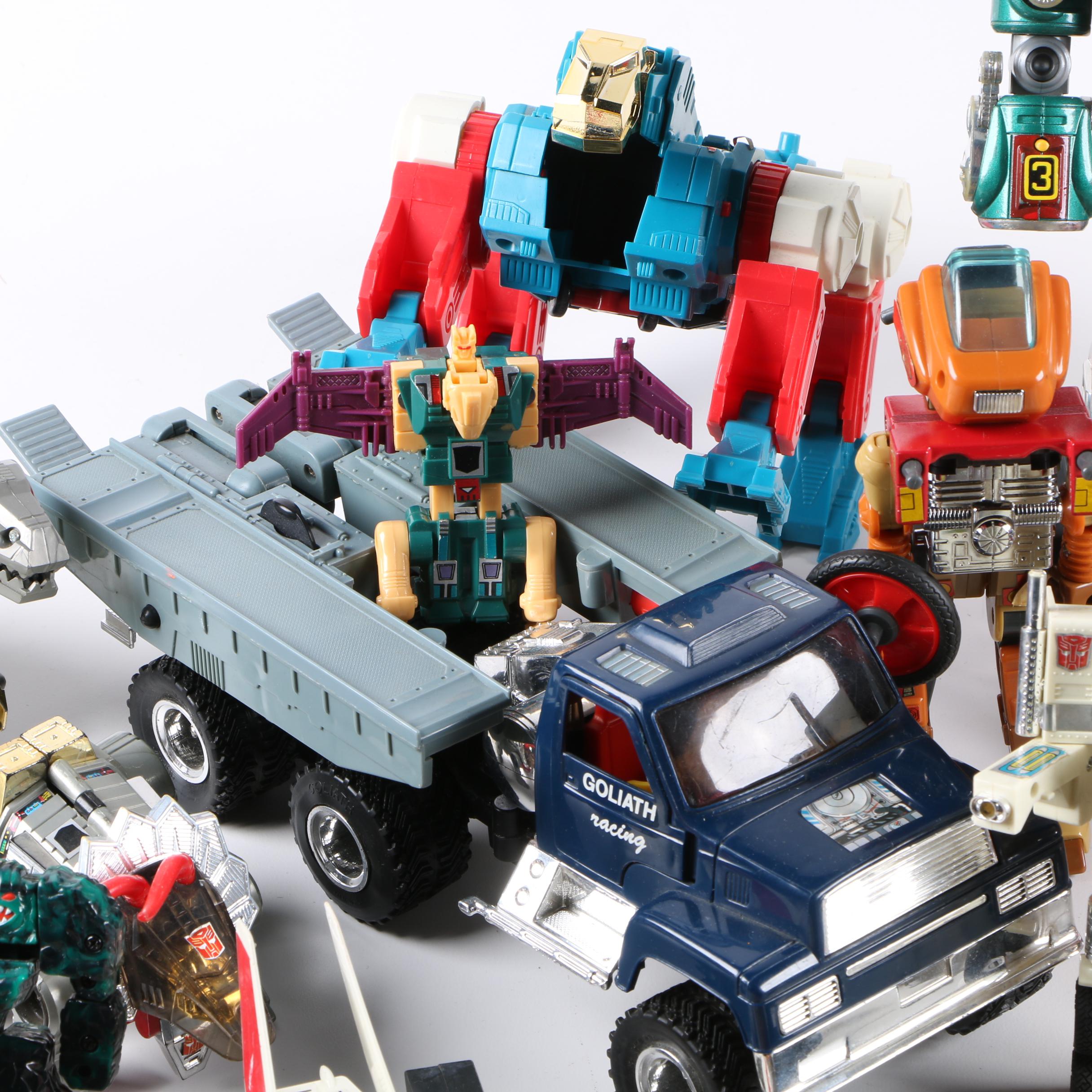 Assortment of 1980s and 1990s Toys Including Transformers