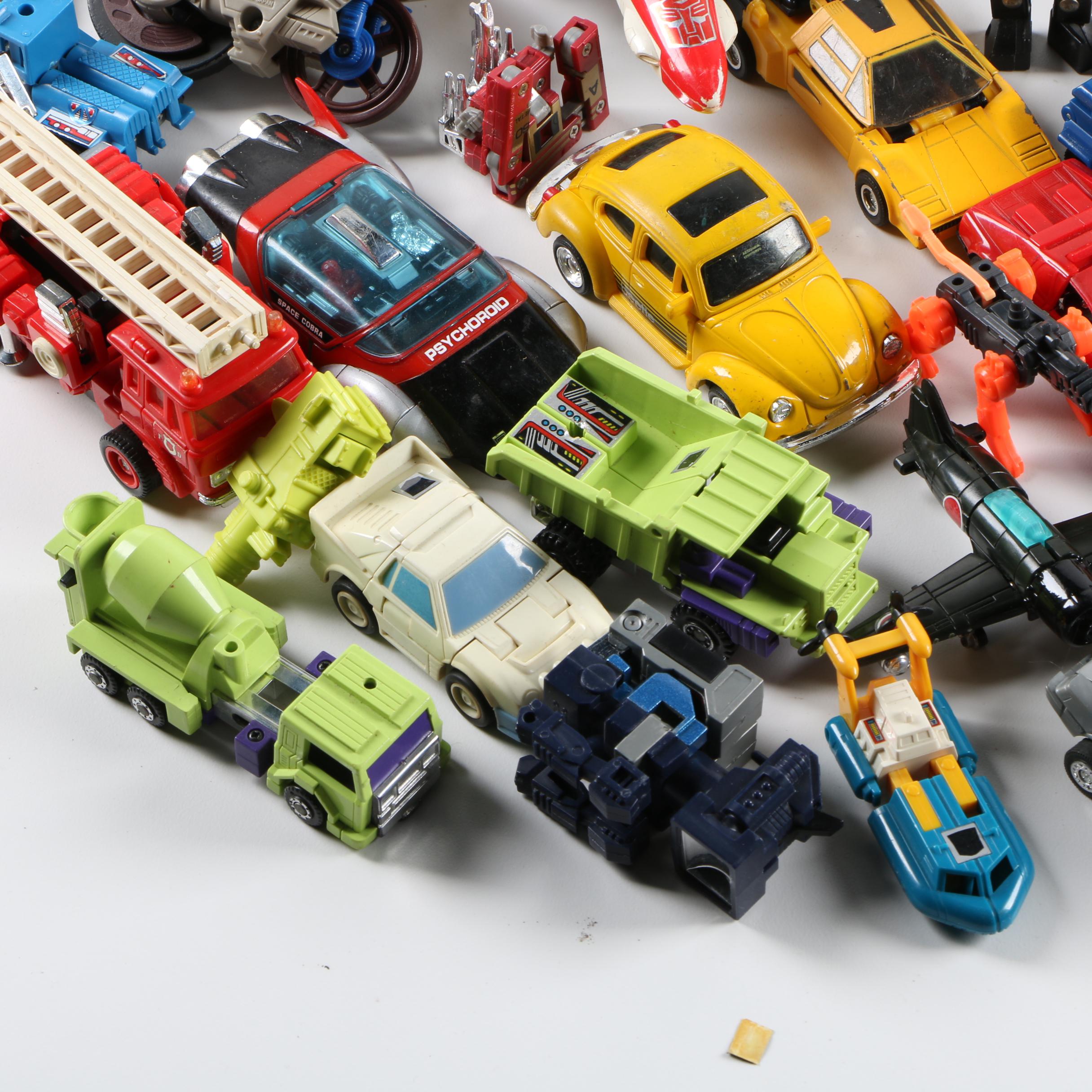 Assortment of 1980s and 1990s Toys Including Transformers