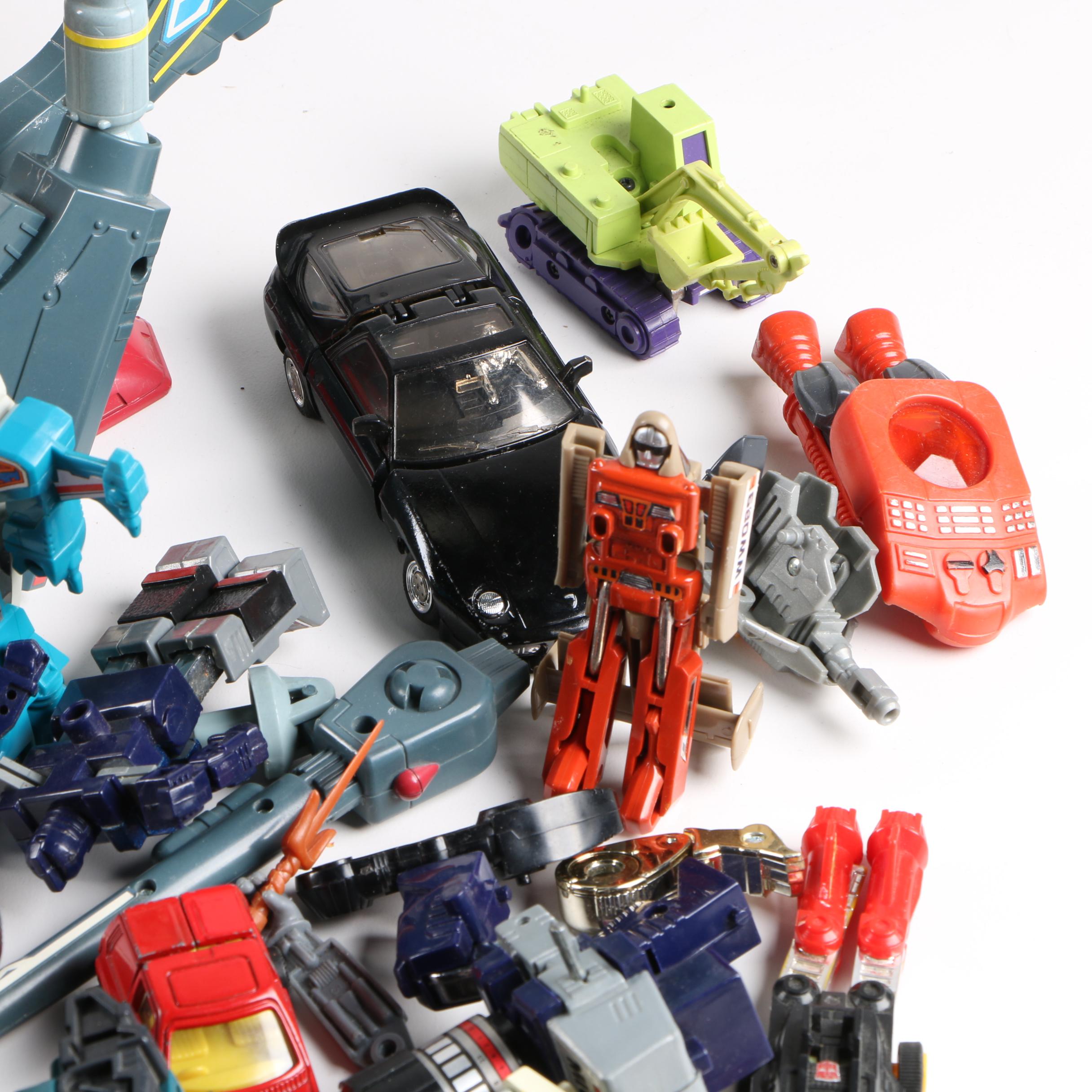 Assortment of 1980s and 1990s Toys Including Transformers