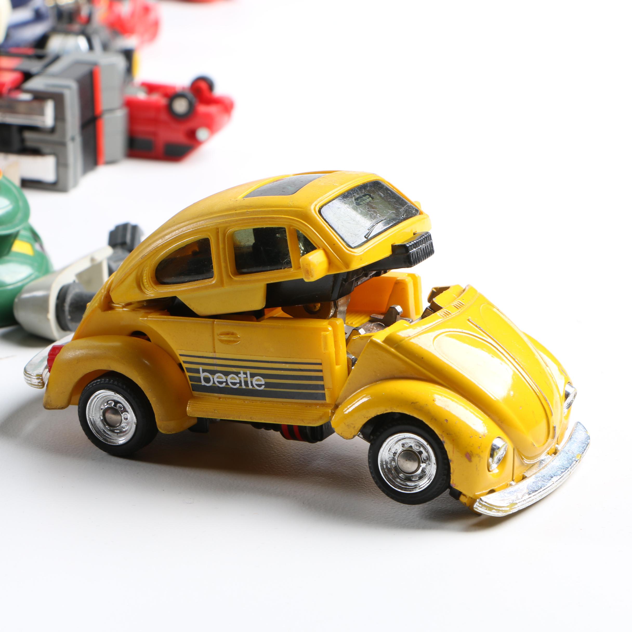 Assortment of 1980s and 1990s Toys Including Transformers