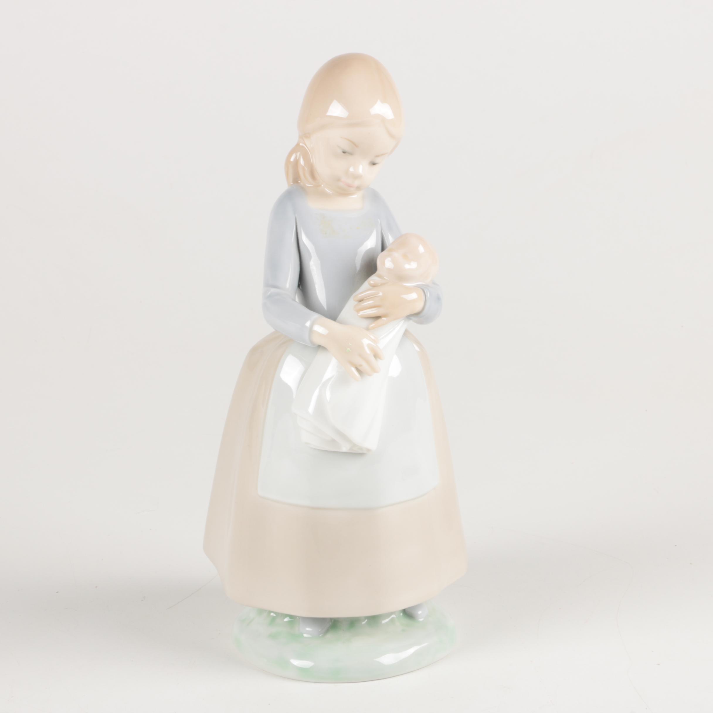 NAO by Lladró "Girl Maid Nanny Holding Baby" Figurine