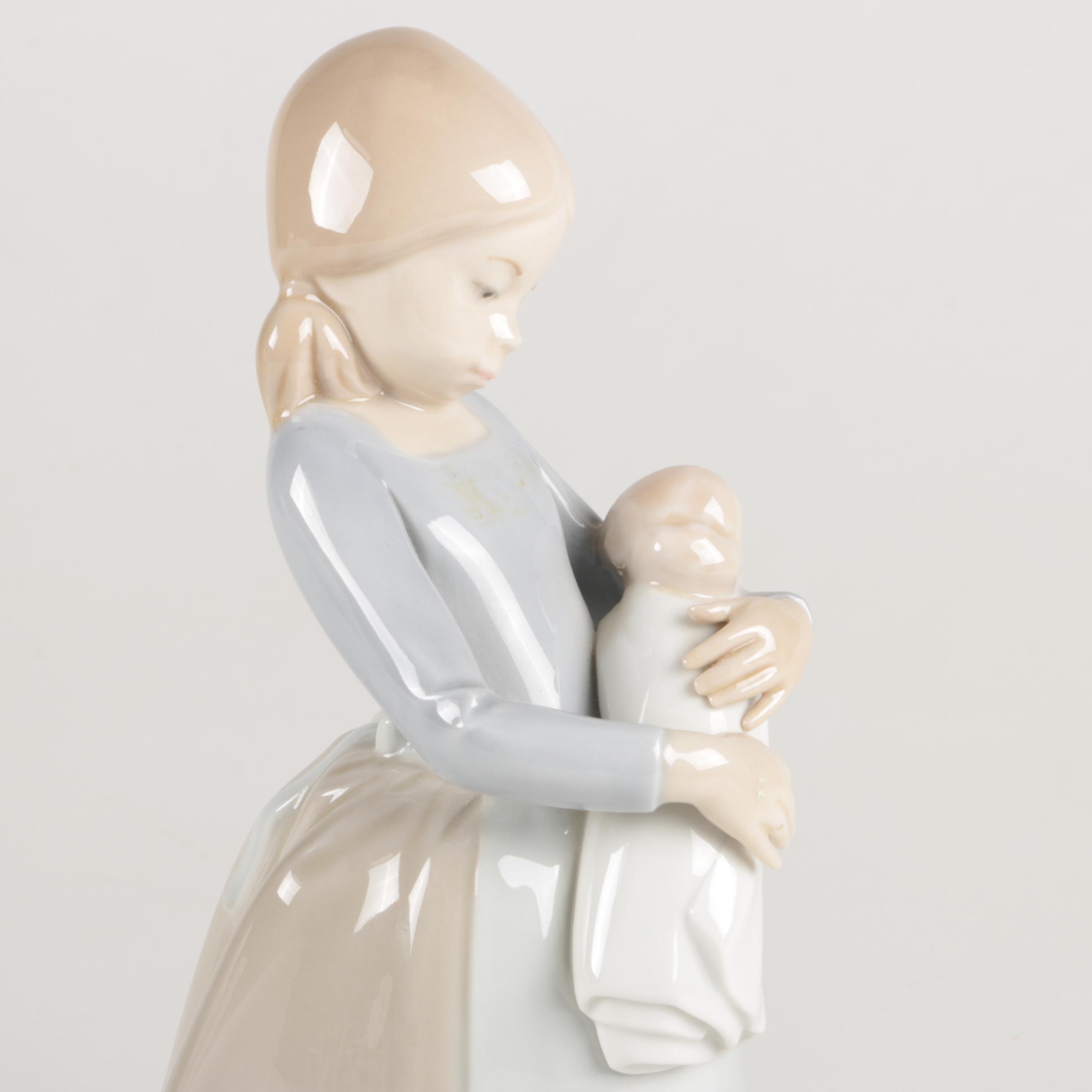 NAO by Lladró "Girl Maid Nanny Holding Baby" Figurine