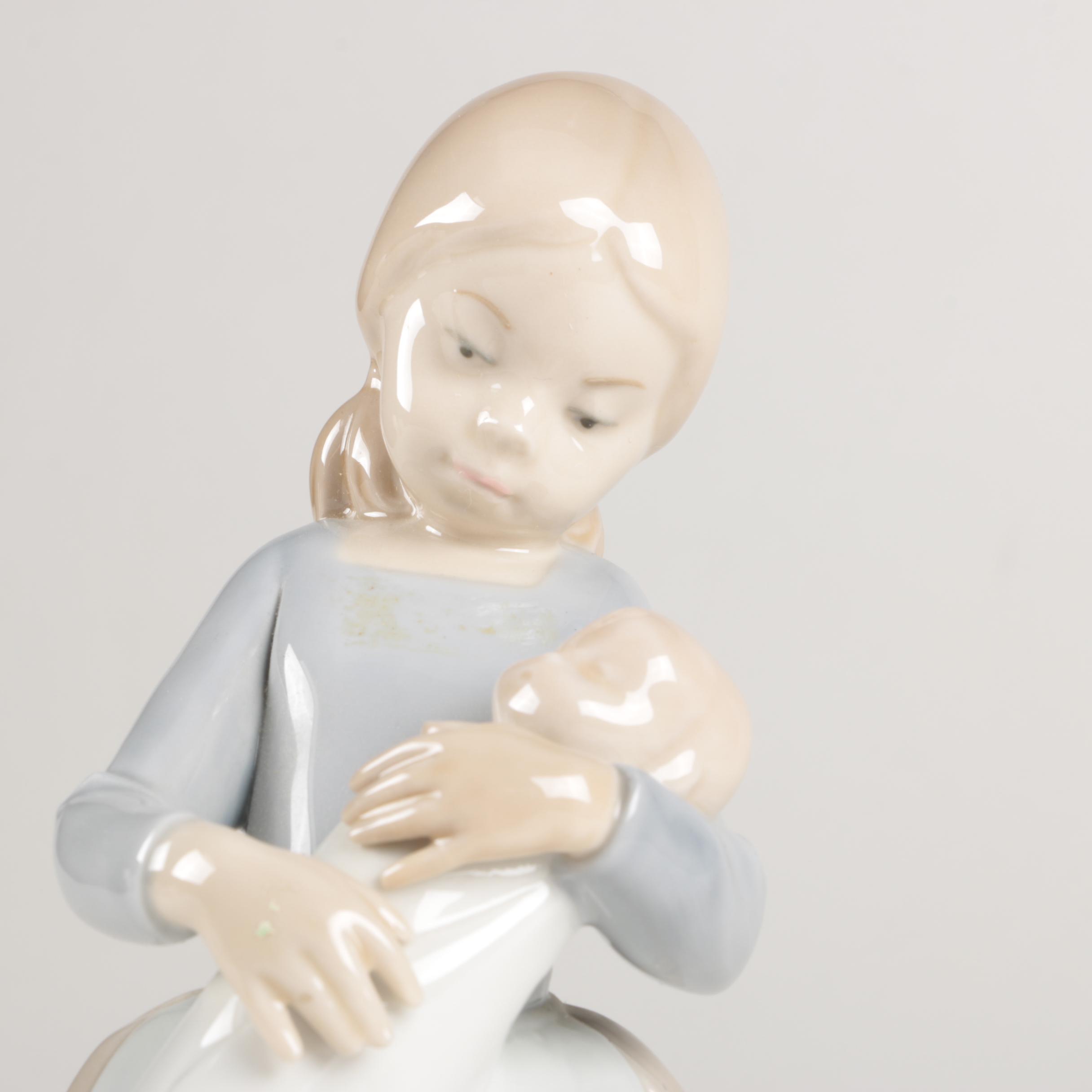 NAO by Lladró "Girl Maid Nanny Holding Baby" Figurine