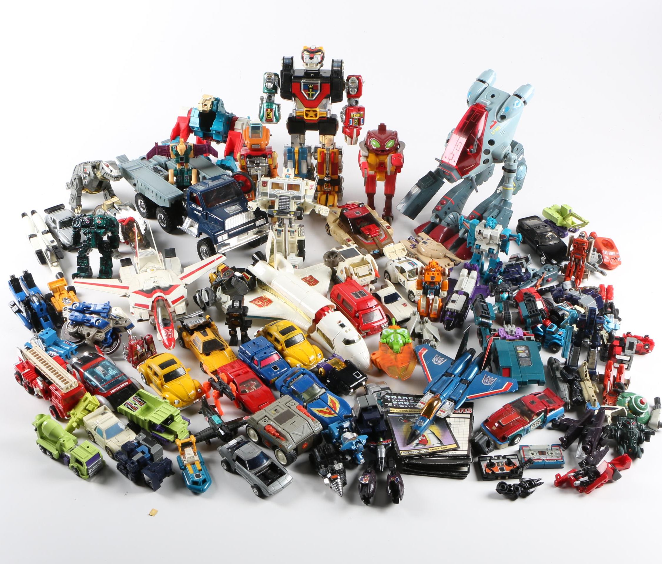 Assortment of 1980s and 1990s Toys Including Transformers