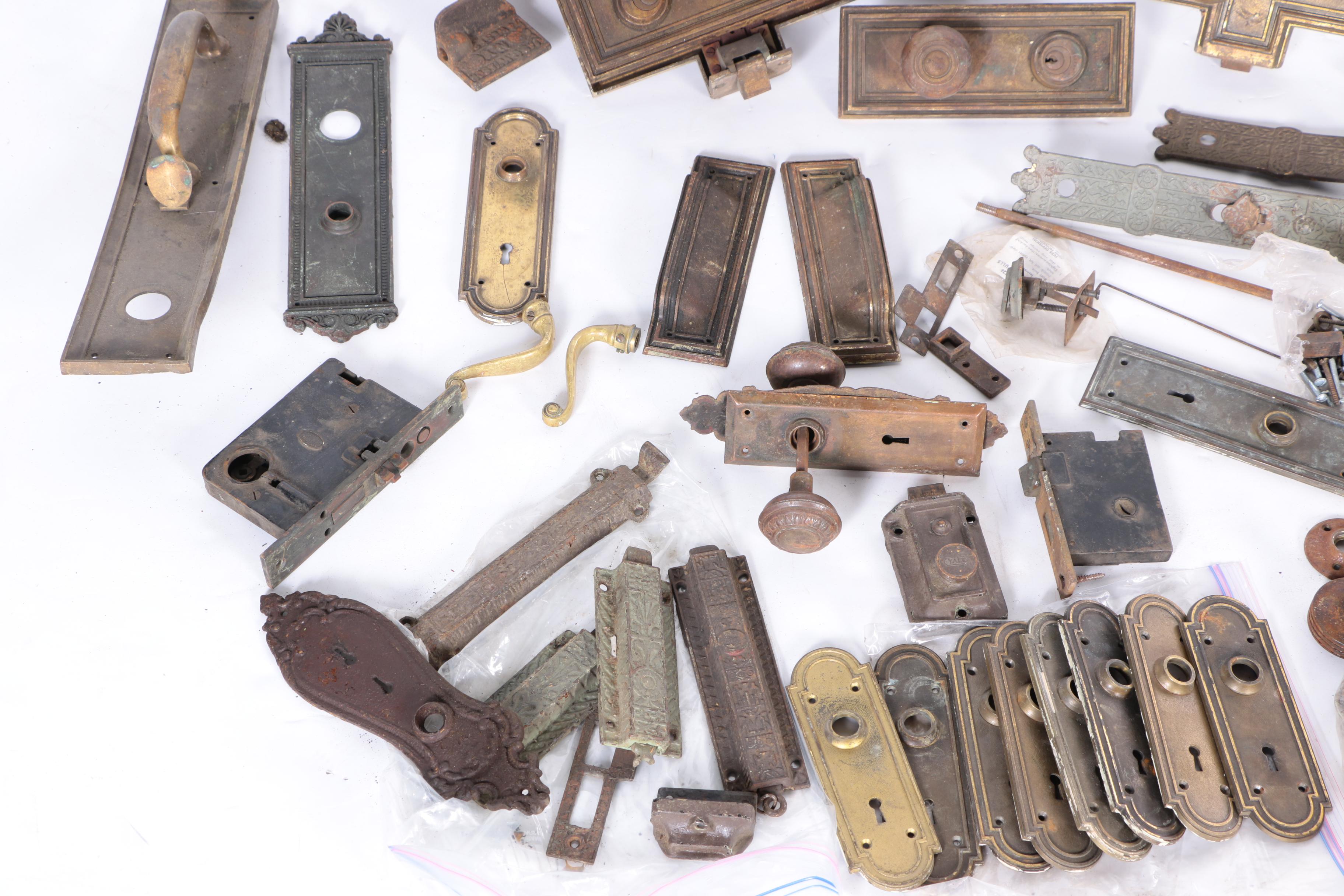 Large Assortment of Door Knobs and Plates