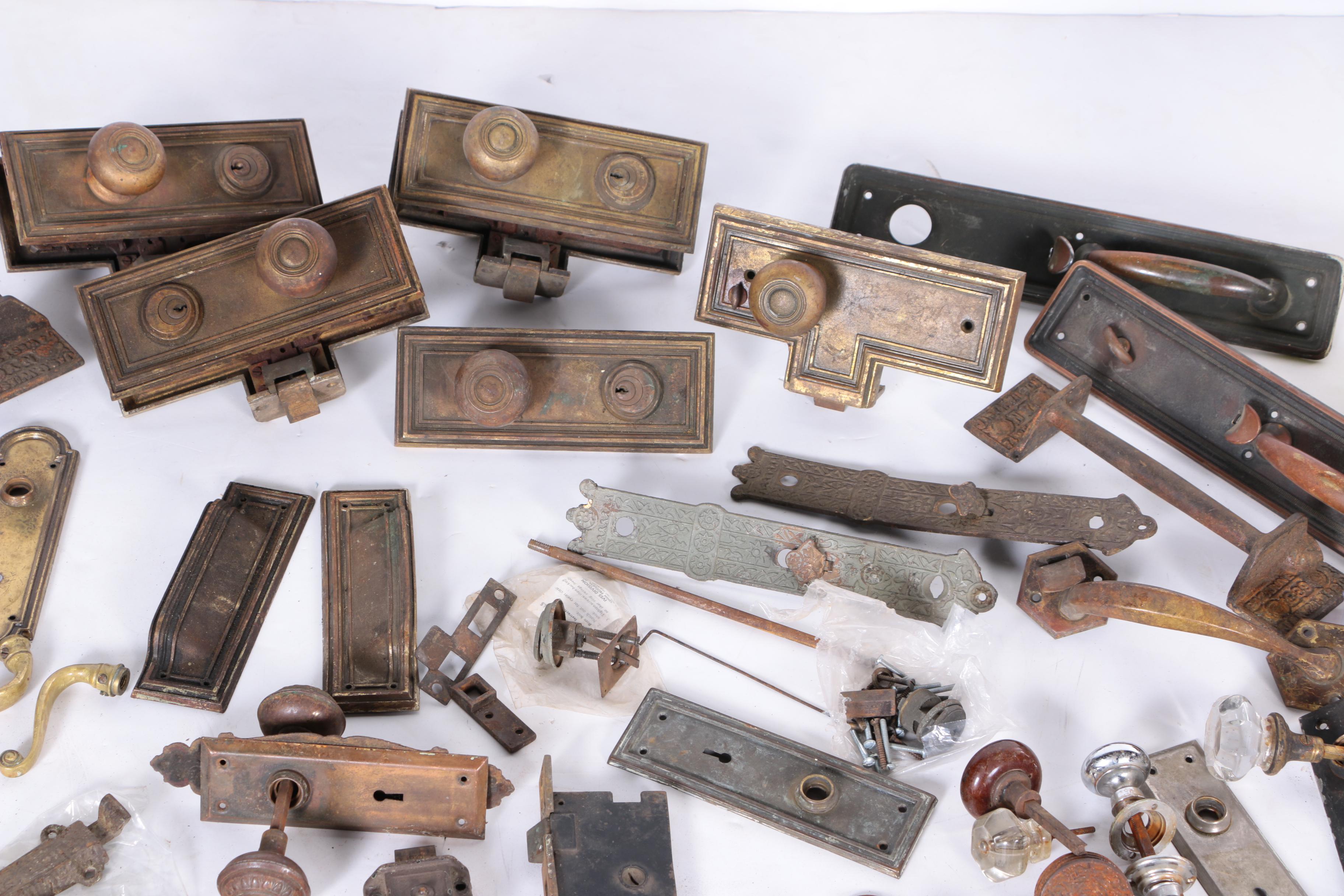 Large Assortment of Door Knobs and Plates