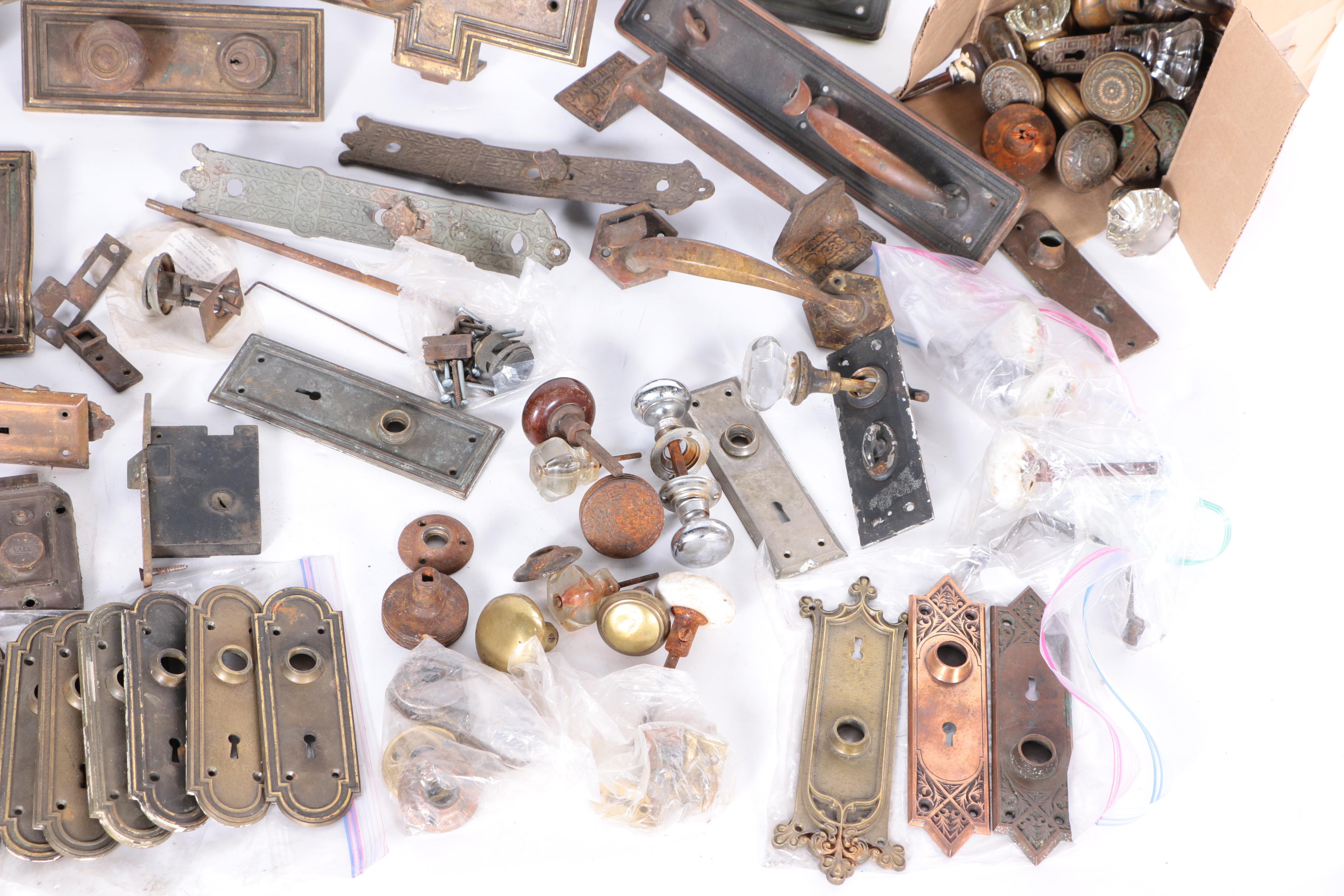 Large Assortment of Door Knobs and Plates