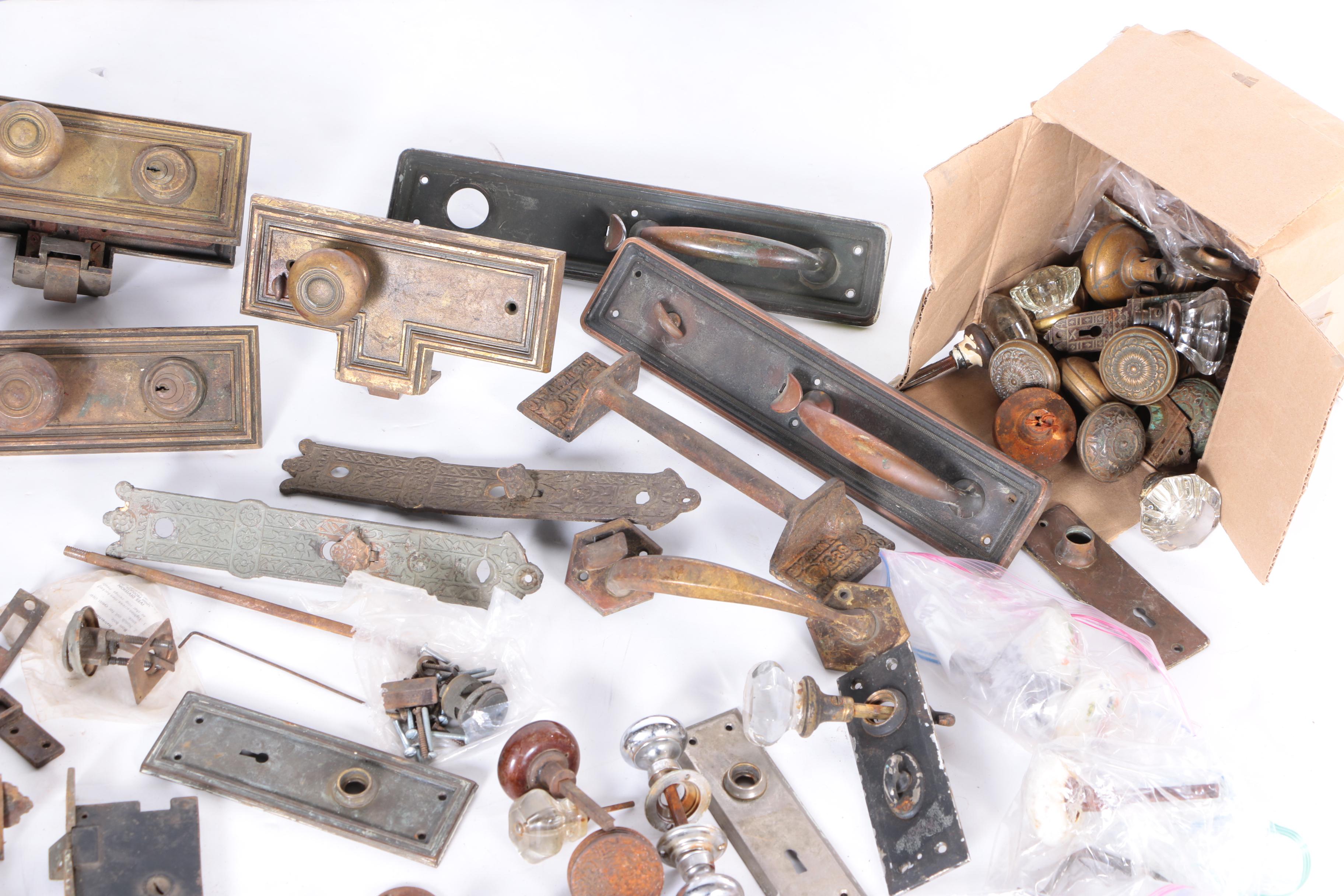 Large Assortment of Door Knobs and Plates