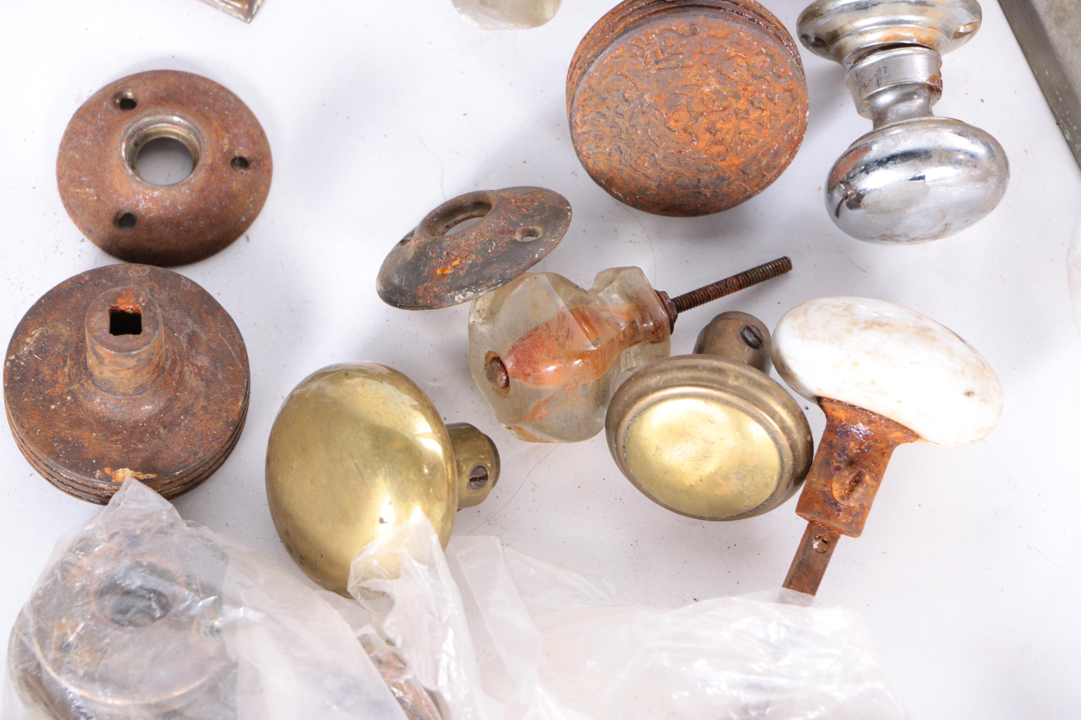 Large Assortment of Door Knobs and Plates