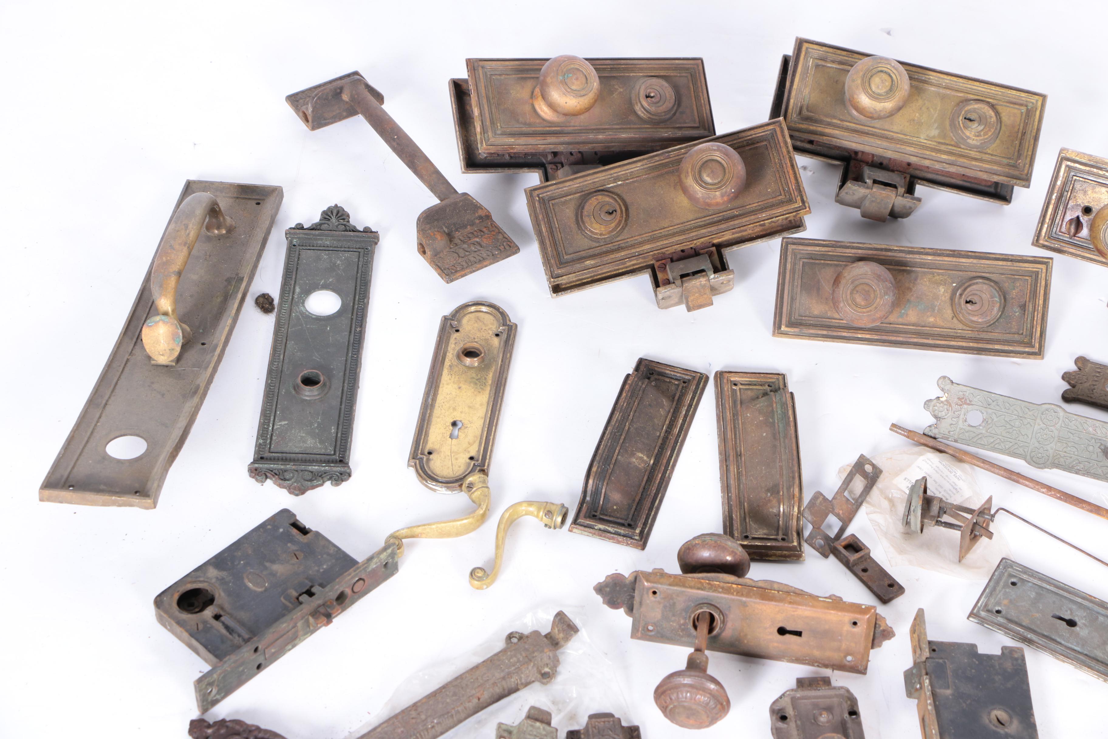 Large Assortment of Door Knobs and Plates