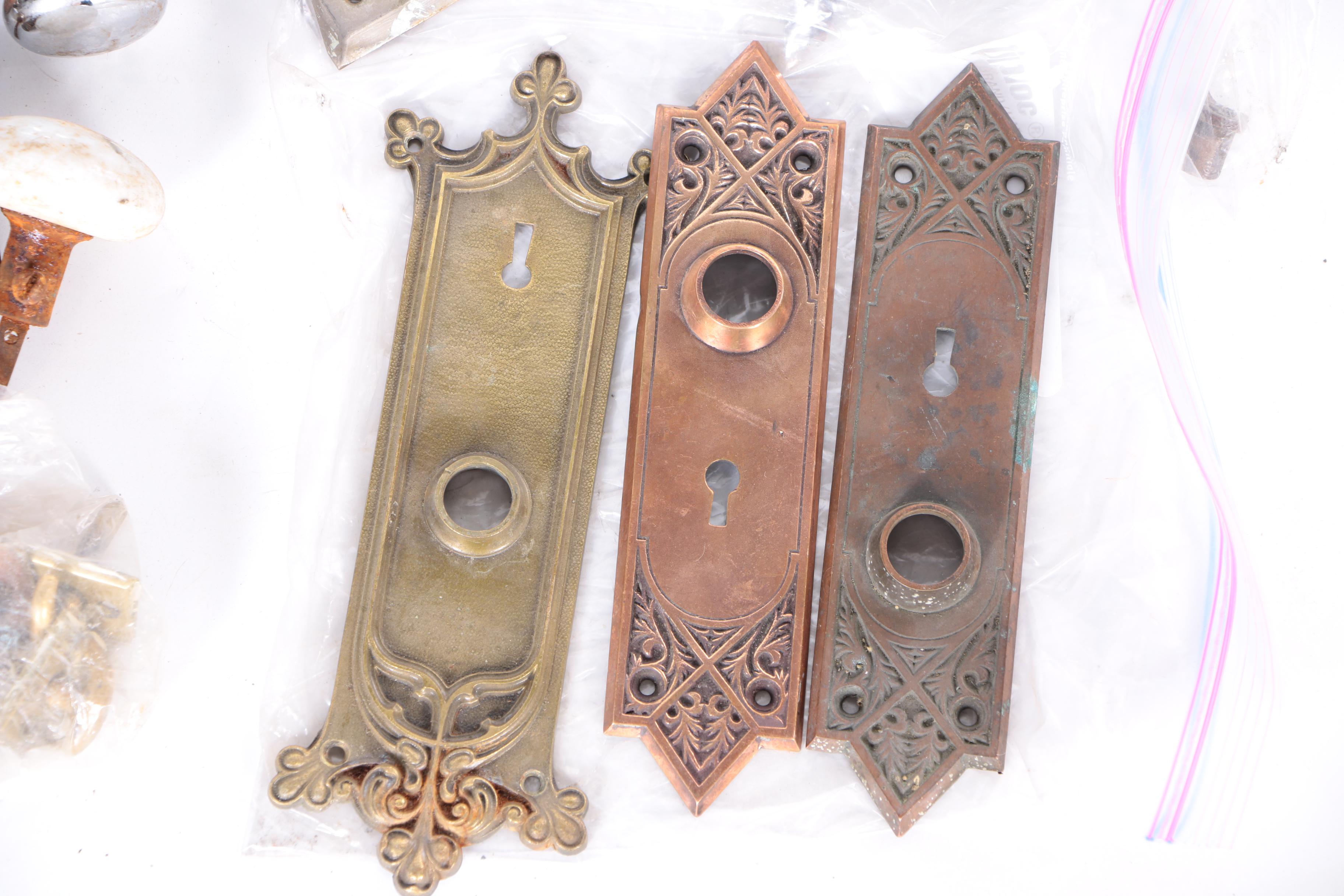 Large Assortment of Door Knobs and Plates