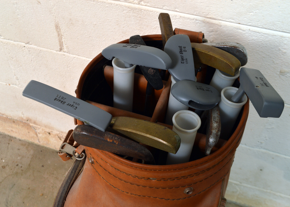 Collection of Putters in Leather Golf Bag
