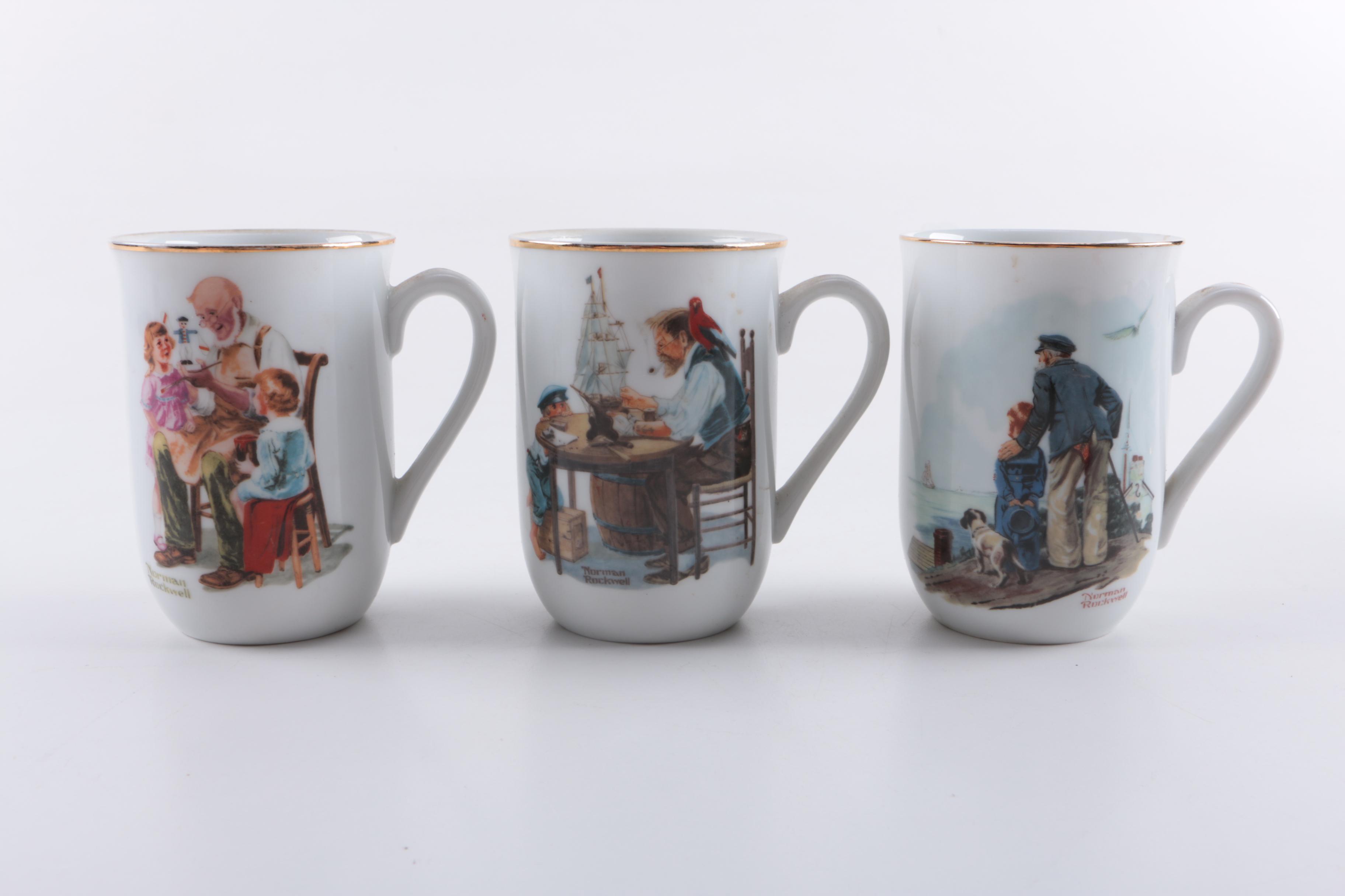 Assorted Collectible Plates and Mugs Featuring Norman Rockwell